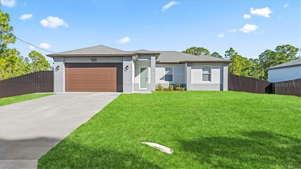 Photo of 759 Silverstar Avenue S, Lehigh Acres, FL 33974 (MLS # A4686315)