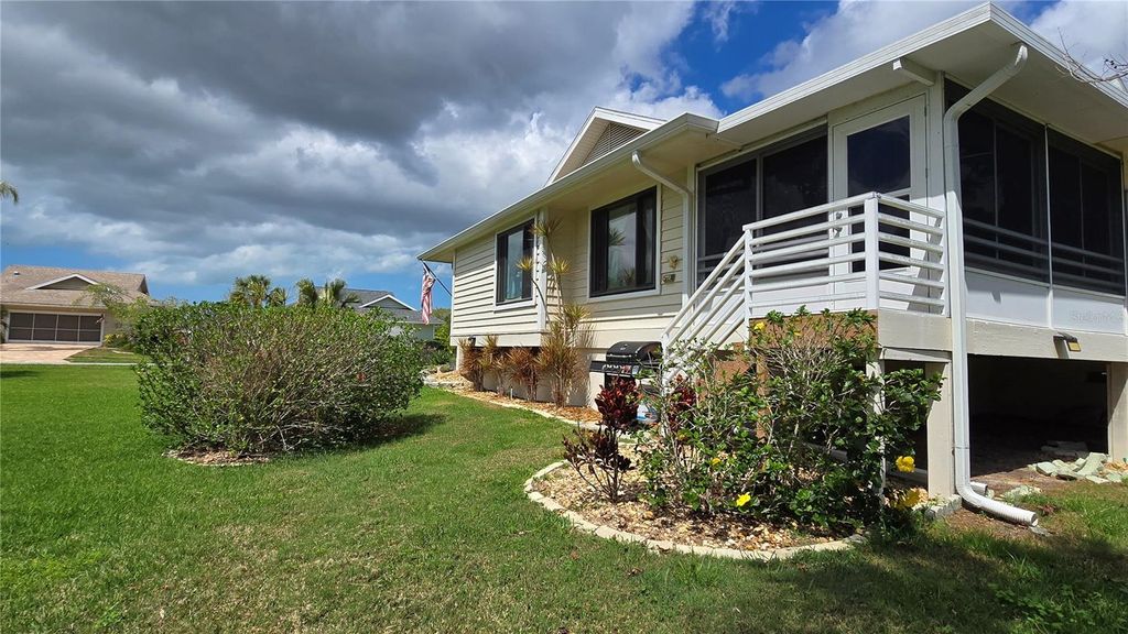 Photo of 1007 Lake Avoca Drive, Tarpon Springs, FL 34689 (MLS # TB8463440)