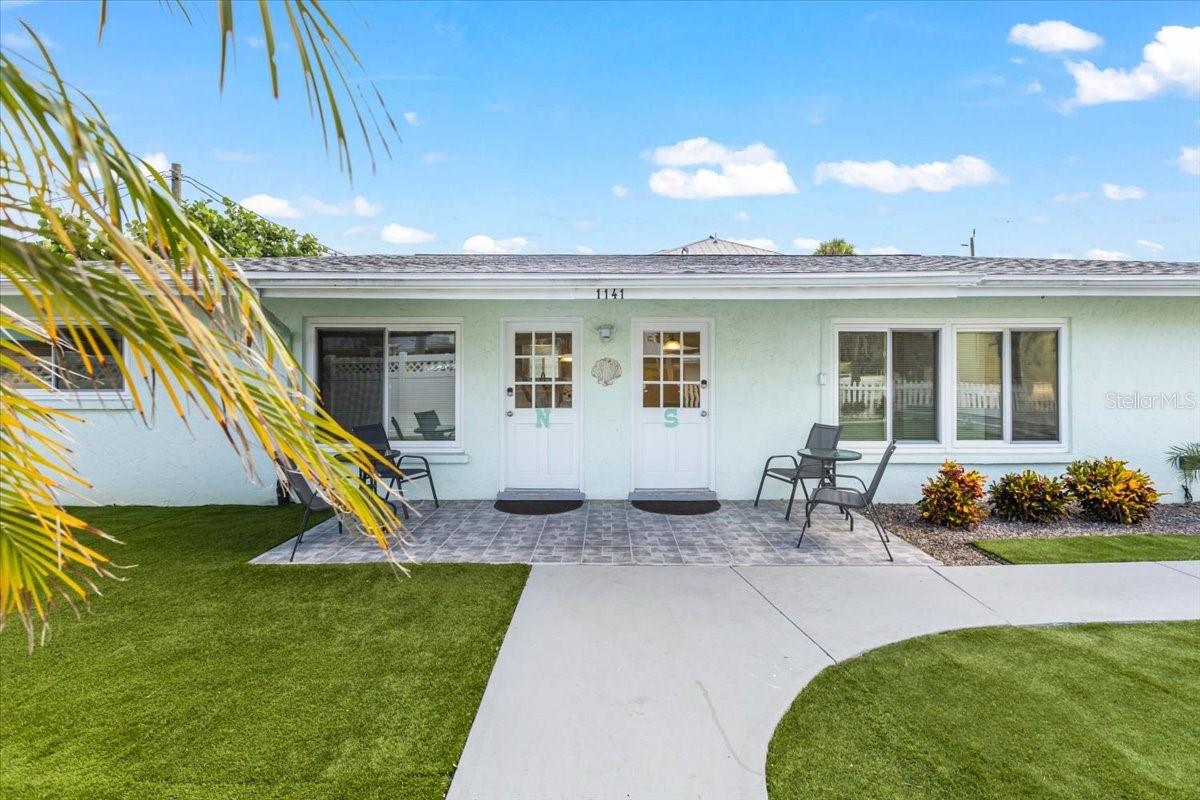 Exceptional Investment Opportunity Awaits! Just a two-minute stroll from the stunning white sands of Siesta Key Beach, Sun & Sea Island Hideaways presents a rare chance to own a fully remodeled, high-income-producing duplex in an ideal island setting. With zoning for short-term rentals, this incredible retreat offers remarkable flexibility: live in one unit while renting the other, or maximize your earnings by leasing both units to vacationers year-round. The property is fully furnished and has future bookings in place, ensuring immediate income potential. Nestled in the sought-after south end of Siesta Key, the property exudes tropical allure with interiors featuring updated terrazzo floors, chic furnishings, and modern upgrades, including new appliances, a new roof, and new AC units for both residences. Each 2-bedroom, 1-bathroom unit is thoughtfully designed for comfort, featuring bright, open living spaces that embody the essence of island living. A shared indoor laundry area adds convenience, while an outdoor shower provides the perfect way to conclude a beach day. The expansive, fully fenced backyard is a private oasis, with lush, low-maintenance landscaping, synthetic turf, and a sizable composite deck perfect for sunset gatherings, outdoor dining, or relaxation. A nearby community pool is accessible to owners and guests, and four designated parking spaces offer added convenience for owners and visitors. With a proven track record of strong rentals and high demand from vacationers, Sun & Sea Island Hideaways is more than just a home—it’s an investment in the ultimate island lifestyle. Whether you're seeking a profitable rental property or a private sanctuary with income potential, this Siesta Key treasure is ready to fulfill your island dreams.