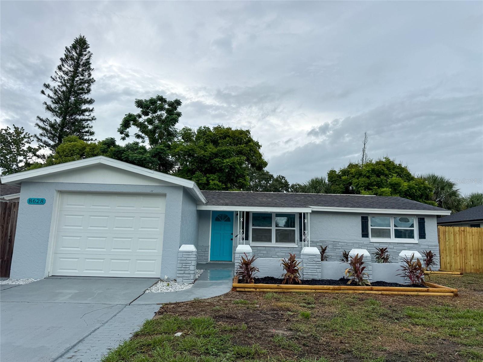 Newly remodeled 3 bedroom, 1.5 bath home with a garage, a den/bonus room and a fenced yard with mature trees for shade in desirable Port Richey. This home boasts tons of recent interior updates with a modern/contemporary flair! Brand new kitchen cabinets with new quartz countertops, new backsplash and brand new stainless steel appliances. New luxury vinyl plank throughout the property for easy maintenance. New paint inside and out, new modern lighting and ceiling fans, new 6 panel doors, new hot water heater and both bathrooms have been renovated along with newer energy efficient vinyl windows thorughout the entire house. A 30 year dimensional shingle roof was installed 2016 and a new central HVAC 2016, so your major ticket items are taken care of for many years. You have laundry hookups in the garage. Outside you have a nice sized yard out front and you can enjoy your days and evenings in the large fenced backyard! The property is located in desirable Port Richey and is just minutes from great restaurants, plenty of shopping, and several beautiful parks and a quick ride to Tampa or the beaches! There is NO HOA, NO Deed Restrictions, and NO Flood Insurance required and has a clean wind mitigation report and 4 point inspection. This home would be great for a 1st time buyer, vacation home, or even move-in ready rental home! Buyer to verify all room sizes.