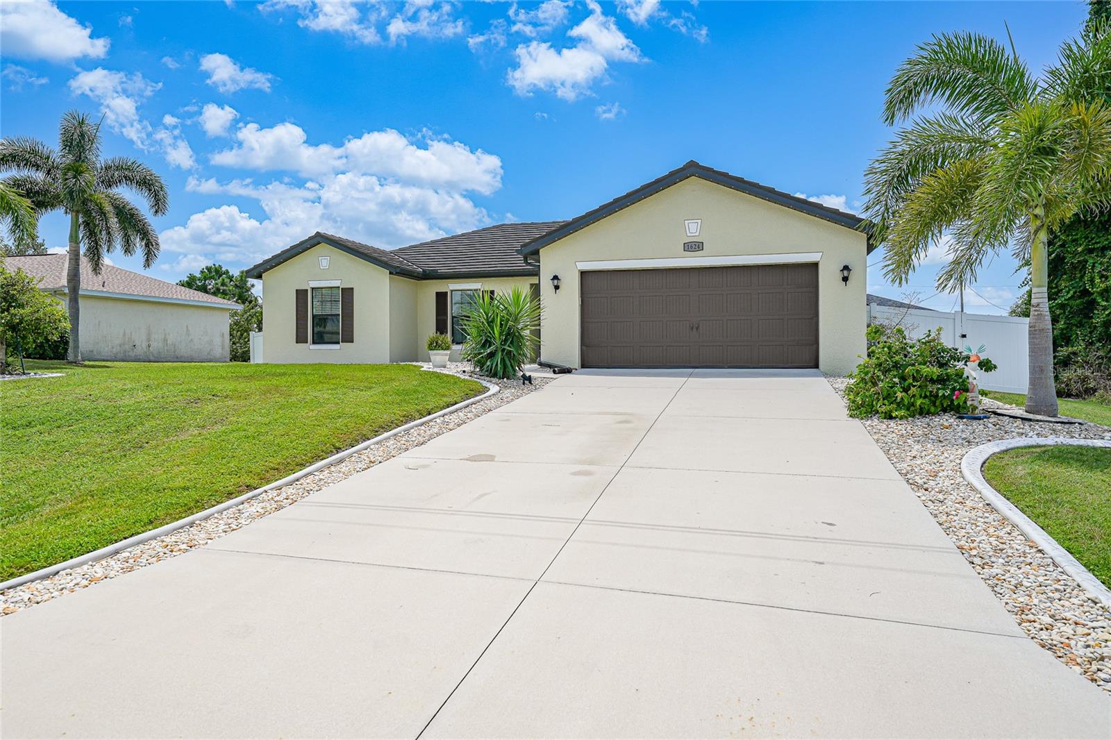 Stylish Comfort in Northwest Cape Coral
Welcome to this charming 3-bedroom, 2-bath home in the sought-after Northwest Cape Coral community—where thoughtful updates meet everyday comfort.
Step inside to a bright open-concept layout, perfect for both entertaining and daily living. The kitchen is a chef’s dream, complete with a snack bar, walk-in pantry, generous counter space, and abundant cabinetry, all flowing seamlessly into the dining area. New upgraded lighting throughout the home enhances every room, while wood plantation shutters add timeless elegance.
The private primary suite features a spacious walk-in closet and an oversized bathroom designed for relaxation. Two additional bedrooms, each with brand-new carpet, offer inviting retreats for family, guests, or a home office. Convenience abounds with an inside laundry room and plenty of storage.
This home has been carefully maintained and updated with big-ticket improvements for peace of mind, including a 2023 metal shake shingle roof and an upgraded AC system with U/V lighting.
Curb appeal shines with a pilon lighted driveway, custom curbing, and river rock accents, all complementing the lush landscaping. The large fenced-in backyard extends the outdoor living experience, providing plenty of space to relax, entertain, or play.
Located close to shopping, dining, pristine beaches, and just minutes from Coral Oaks Golf Course, this home combines comfort, style, and prime location.
Don’t miss the chance to make this move-in-ready gem yours!