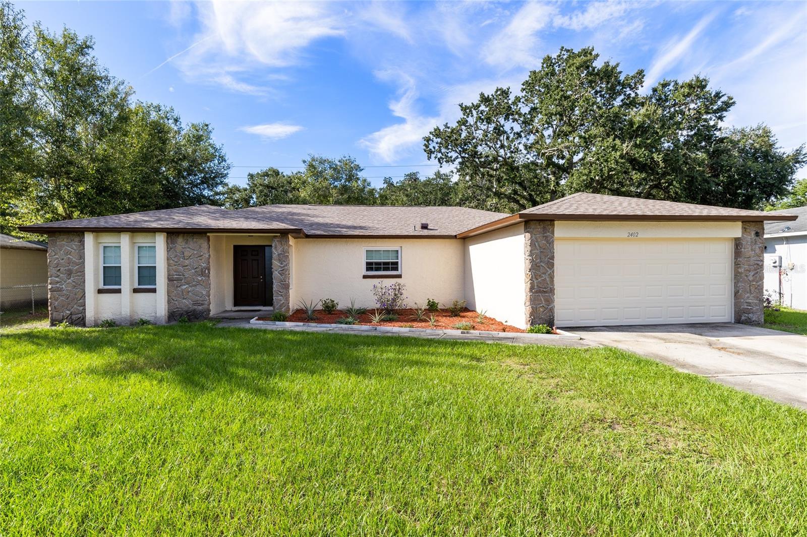Welcome to this 3-bedroom, 2-bath home in the Oak Run community. Featuring a spacious 1,554 sq ft layout, this single-story residence combines comfort and convenience in a prime Kissimmee location. The home offers a light-filled living area, an eat-in kitchen, and a primary suite with a walk-in closet. Two additional bedrooms provide flexibility for family, guests, or a home office. Step outside to a large, screened patio overlooking the backyard—perfect for relaxing or entertaining. The exterior showcases fresh landscaping, a two-car garage, and a newer roof, giving peace of mind. Situated on a 0.20-acre lot with mature trees, the property provides shade and privacy while maintaining easy access to schools, shopping, dining, and major highways. With no HOA, this home is an excellent choice for homeowners or investors.