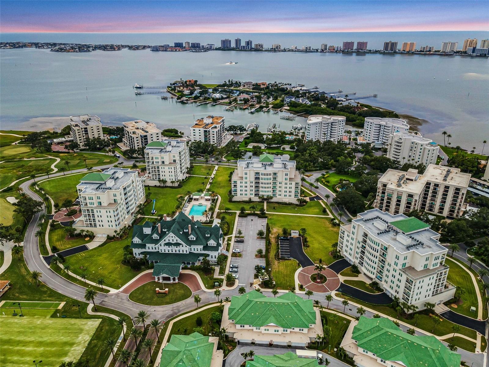 Experience Elevated Living in Carriage Homes at Belleview Place! This stunning 3-bedroom, 3-bath townhome offers luxury living in a prime location, nestled within the renowned Belleair Country Club and just minutes from the pristine Gulf beaches. Built in 2020, this home was constructed with the highest standards, this gated community provides comfort, security, and convenience with 24-hour security and a private in-unit elevator. Since it was built, there have been roughly $100k worth of updates done to truly make this a one-of-a-kind home! As you step inside, you're greeted by an abundance of natural light that highlights the spacious open-concept floor plan. Motorized blinds throughout the first and second floors allow effortless control of lighting and privacy. The main living area is anchored by a striking fireplace adorned with a mother-of-pearl backsplash, surrounded by an illuminated custom bookcase, also adorned with mother-of-pearl backsplash; a truly elegant focal point. In the living room, a stunning Murano lamp (included in purchase) from Murano, Italy adds a unique touch of European charm as well as a sense of uniqueness. The gourmet kitchen features custom cabinetry, sleek quartz countertops, SUB-ZERO, WOLF & COVE appliances, and a large walk-in pantry. The adjacent private wine room, which can also serve as an additional oversized primary suite, features a large Cedar closet, perfect for special items and fur coats. This room offers a serene retreat with earthy tones perfect for unwinding or entertaining. Upstairs, the primary suite includes a luxurious en-suite bath with a large linen closet, rainfall glass shower doors with water-repellent treatments, and rainfall shower head; exactly what can be throughout all of the en-suite bathrooms. The walk-in closet has a Cedar Closet built in as well; adding additional convenience when it comes to storing special items. Step out onto your private balcony, just outside of the primary bedroom. Here you will catch some of the most breathtaking sunsets Florida has to offer. Additionally, just off of the upper landing you'll find a cozy den offering another versatile space to relax or work. The air handler on the second floor, upgraded just 4 years ago, is equipped with a dehumidifier and air scrubbers (added 3 years ago) for enhanced indoor air quality and comfort. Additional highlights include: Motorized blinds throughout both floors, Mother-of-pearl accents on the elevator panels, Large 2-car garage in the rear with tankless water heater, water softener, and a small patio perfect for grilling, Laundry room on the first floor with custom cabinetry, granite countertops, and a Kohler farmhouse sink.
No flood zone and no flood insurance required, as this property is situated on one of the highest points in Pinellas County. You’ll also enjoy access to golf, tennis, and marina amenities, making this a truly rare opportunity to own a slice of Belleair’s finest lifestyle. Schedule your private showing today and experience the perfect blend of elegance, comfort, and convenience. Furnishings negotiable.