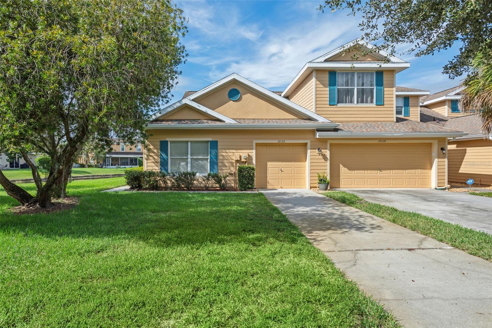 ENJOY MAINTENANCE-FREE FLORIDA LIVING! This meticulously maintained townhome is an amazing opportunity that features a gorgeous private waterfront lot located in the highly sought after gated community of LIVE OAK PRESERVE! The property is an end-unit 1 story townhome with gorgeous water views. Home features 1,249 sq ft with a fantastic open floor plan, with 2 bedrooms, 2 baths & 1 car garage with oversized driveway & plenty of guest parking. This is the perfect place to call home! Enter into a spacious living room and dining area that offers plenty of natural light and great for entertaining guests. The spacious kitchen features ceramic tiling, an abundance of cabinetry, appliances, breakfast bar & pantry. Right off the kitchen is a dining area that is perfect for enjoying your dinner parties with fantastic water views. Great size family room perfect for entertaining, features double sliders that opens to a huge private extended screened lanai that invites you to sit & enjoy day & evening sun sets that looks out to a beautiful water view. Plenty of backyard space to enjoy BBQ’s with family & friends. Large Master suite features his & hers walk-in closets with double sliders to screened lanai & beautiful water views. Master bath with his & hers sinks with large walk-in shower. Monthly HOA fee covers exterior maintenance, outside insurance, exterior paint, roof, lawn care & irrigation. The interior was just painted, exterior has been painted 2022 & roof installed 2018, water heater 2018. LIVE OAK PRESERVE is a highly desirable gated community which offers resort style amenities which includes a clubhouse, large swimming pool with kid’s water splash area, lap swimming area, fitness center, lighted tennis courts with pickle-ball area, volleyball court, basketball court, playground, walking trails, golf putting area & much more. Close to schools, I-75, Tampa International Airport & downtown Tampa, MacDill AFB, hospitals, shopping, Wiregrass Mall, Outlet Mall, schools, golf courses, restaurants. The elementary, middle & high schools are conveniently located just outside the community gates. DO NOT MISS YOUR CHANCE! CALL TODAY FOR A PRIVATE TOUR OF THIS STUNNING HOME!