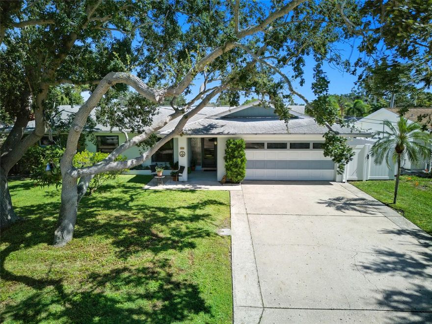 Waterfront Living in Patrician Point — Ready for Its Next Chapter
Situated in the highly sought-after Patrician Point neighborhood of Northeast St. Pete, this solid block waterfront home offers 75 feet of seawall, a private dock with boat lift, and no low bridges between you and open water — bring the big boat. For over 30 years, this property has been lovingly cared for by one family and is now ready for its next owners to make it their own. Step inside to a bright, open layout with porcelain tile flooring and original terrazzo preserved underneath — still visible in one of the bedrooms and ready to be refinished to its former mid-century glory. The split floor plan includes a spacious primary suite with walk-in closets and ensuite bath, plus a guest suite with its own bath — ideal for visitors, a nanny, or extended stays. A large family room with wood-burning fireplace anchors the back of the home, opening to a generous deck overlooking the canal. And yes — the pool table conveys. Tesla solar panels are fully paid off, keeping average monthly power bills around $30. Mature landscaping and established trees add privacy and charm, and unlike many nearby waterfront pockets, the streets leading to the home don’t flood during heavy rains or high tides — a major advantage in this area.
Waterfront block homes in Patrician Point under $1M are increasingly rare. This is a standout opportunity to bring your vision to life in one of St. Pete’s most desirable boating communities.