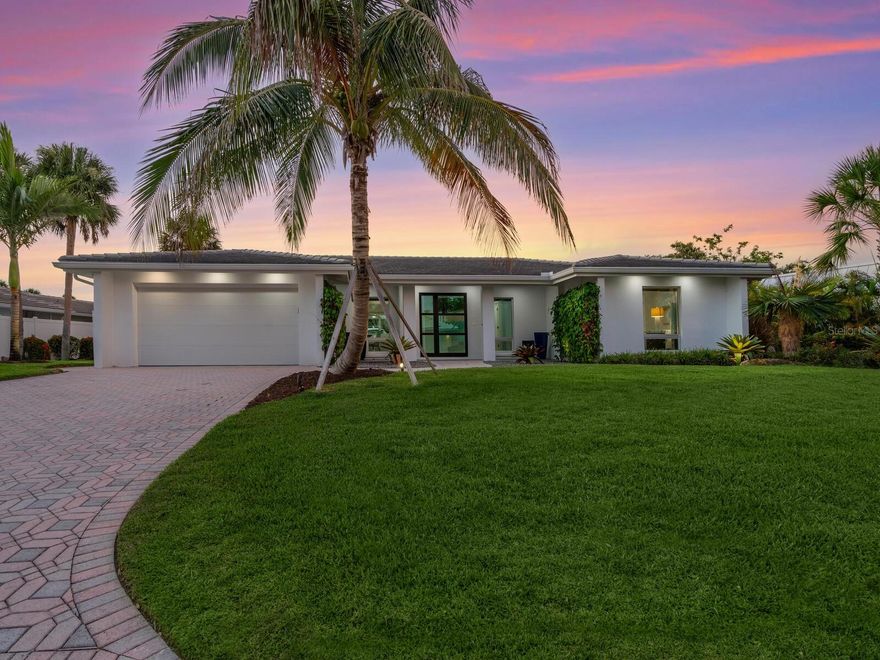 Welcome to Siesta Isles on Siesta Key where you will find this completely remodeled and fully furnished 3-bedroom/ 2 bath pool home on the Grand Canal basin.  All the hard work has been finished and now is the time to enjoy. This stunning home is located 6/10ths of a mile walk to the world-famous Siesta Key Beach. As you enter the home you will immediately appreciate the amazing light filled open floor plan design. The kitchen has been arranged to allow for interacting with the family and guests while preparing great meals and refreshments on the large waterfall island. An oversized great room with a full wall of pocket sliders allows for bird, fish and Manatee watching or fabulous movie nights. The master Bedroom has pocket sliders that open directly out to the covered lanai.  The views continue out the rear of the home to a beautiful saltwater pool and large deck also offering a covered lanai with motorized screens. Wander down to the dock which features a IMM 16,000 lb. boat lift with water and electric service. Enjoy your evenings dockside at the outdoor fire table while listening to the pool fountain surrounded by the lush lit landscaping.
 The Grand Canal will take you out to the Intercoastal Waterway.  You will enjoy the relaxed feel you get from this exceptional property.