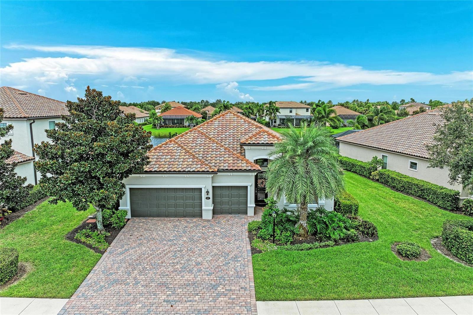 Welcome to Bridgewater at Lakewood Ranch, a highly desirable gated and maintenance-free community offering elegance, convenience, and the quintessential Florida lifestyle. Nestled in the heart of America’s #1 master-planned community, this popular Stanford model having a new A/C, rain gutters and freshly painting exterior combines a spacious open floor plan with thoughtful design, making it ideal for entertaining, hosting guests, or enjoying everyday living. This four-bedroom, three-bath meticulously maintained home with a three-car garage immediately impresses with its lush landscaping, tiled roof, and pavered driveway. Step through the etched glass front door into a light-filled interior where 10-foot ceilings, crown molding, and expansive views of the lake and pool set the tone for refined yet relaxed living.
At the heart of the home, the gourmet kitchen is both stylish and functional, featuring granite countertops, solid wood cabinetry, Stainless steel appliances, a breakfast bar, island bar, and spacious eat-in nook. Whether cooking for family or entertaining a crowd, this kitchen was designed to impress. The open-concept great room flows seamlessly outdoors through three-panel sliding doors, framing tranquil views of the sparkling pool, spa, and serene lake beyond. The owner’s suite is a private retreat with a tray ceiling, a custom-designed walk-in closet, and an ensuite bathroom offering dual vanities, a soaking tub, and a glass-enclosed walk-in shower. A split floor plan provides privacy for family and guests: two bedrooms share a Jack-and-Jill bath, while the fourth bedroom features its own ensuite. Every detail has been thoughtfully enhanced, including custom lighting, recessed illumination inside and out, upgraded angled tile, rich laminate flooring, custom fans, and under sink reverse osmosis system.
Outdoors, your private oasis awaits. The extended screened lanai features a gas-heated pool and spa, with custom lighting that creates a spectacular atmosphere at the touch of a button. With tranquil views, evenings here are nothing short of magical—perfect for dining al fresco, entertaining, or simply relaxing under the stars while taking in the beauty of Florida wildlife and lakeside foliage. Bridgewater at Lakewood Ranch is a friendly community of just 275 single-family homes—no townhomes or condos—offering manicured landscaping, walking paths, a playground, and a lakeside gazebo. With low HOA fees covering lawn care, reserves, and common area maintenance, residents enjoy true ease of living. Ideally located, you’ll be just minutes from University Town Center Mall, Benderson Park’s world-class rowing facility, Lakewood Ranch Hospital, championship golf, fitness centers, and an abundance of dining and shopping options. Families will appreciate proximity to top-rated schools, including Lakewood Ranch Preparatory Academy. White-sand Gulf Coast beaches and vibrant downtown Sarasota are a short drive away, while I-75 provides convenient access to Tampa, St. Petersburg, and beyond.
Whether you’re seeking refined design, modern upgrades, or the perfect Florida lifestyle, 13117 Ramblewood Trail delivers it all-and more!
________________________________________
