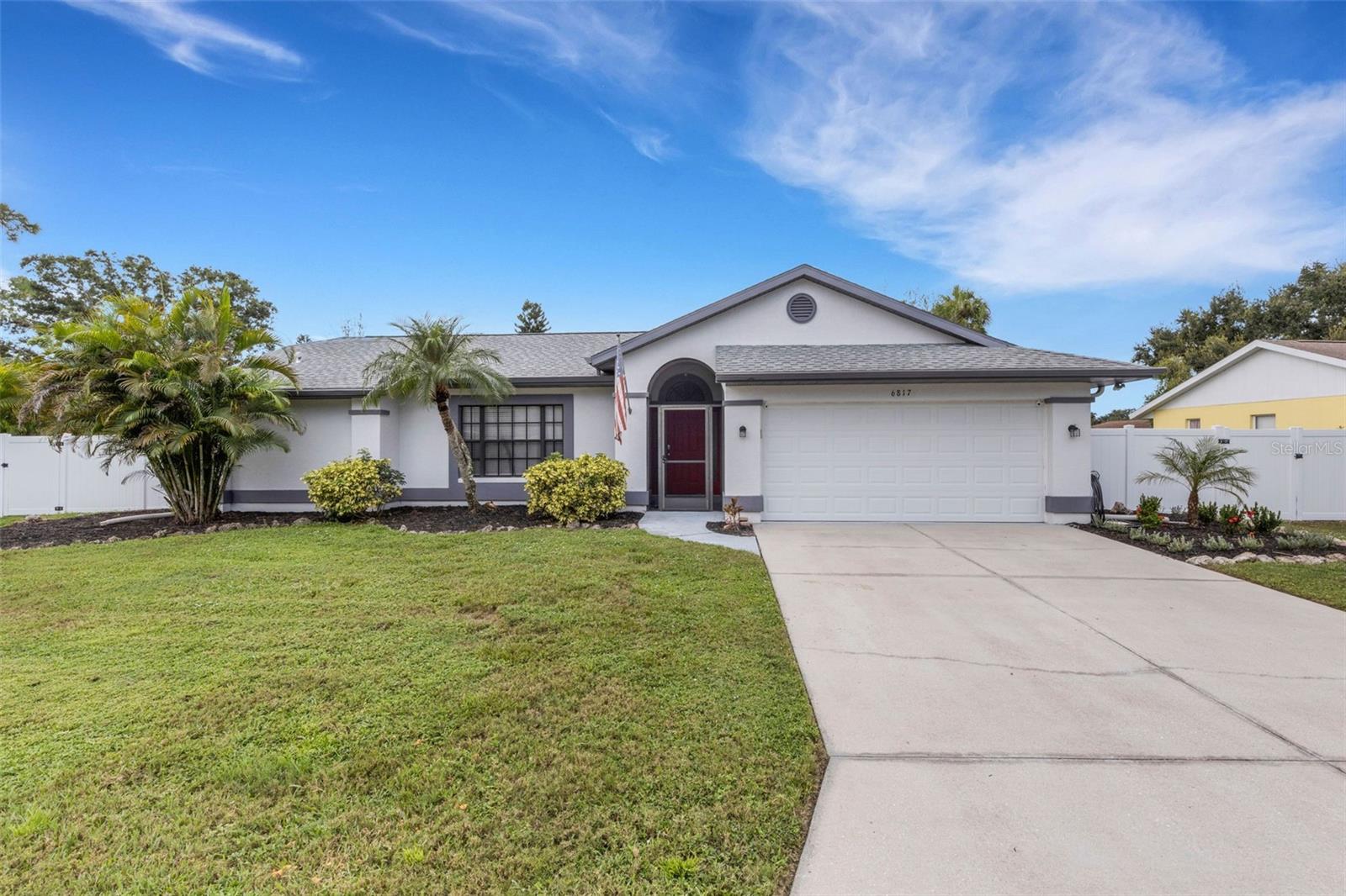 Amazing price! Perfect location! Incredible sparkling pool home with a fully fenced oversized lot! This rare yard features a 14x24ft pool and paver fire pit for unlimited fun. The side lawn area is big enough for boat or tailor storage. 1669 sq ft, 3 bedrooms, walk-in closets, 2 full baths (one doubles as pool bath), desirable split floor plan, some vaulted ceilings, tile floors throughout, sunny skylight in the kitchen, large living room/dining room as well as a spacious family room with natural fireplace. Sweet lanai, kitchen pass through window for maximum entertaining ease. Impressive home or seasonal retreat. 2017 Roof. 2018 HVAC. 2 car attached garage. Zone x! Close to 301, 41 and 275. Easy Tampa or St Pete commute. Schools and golf courses nearby. Low HOA fee. Relaxed rental rules too. Must see!