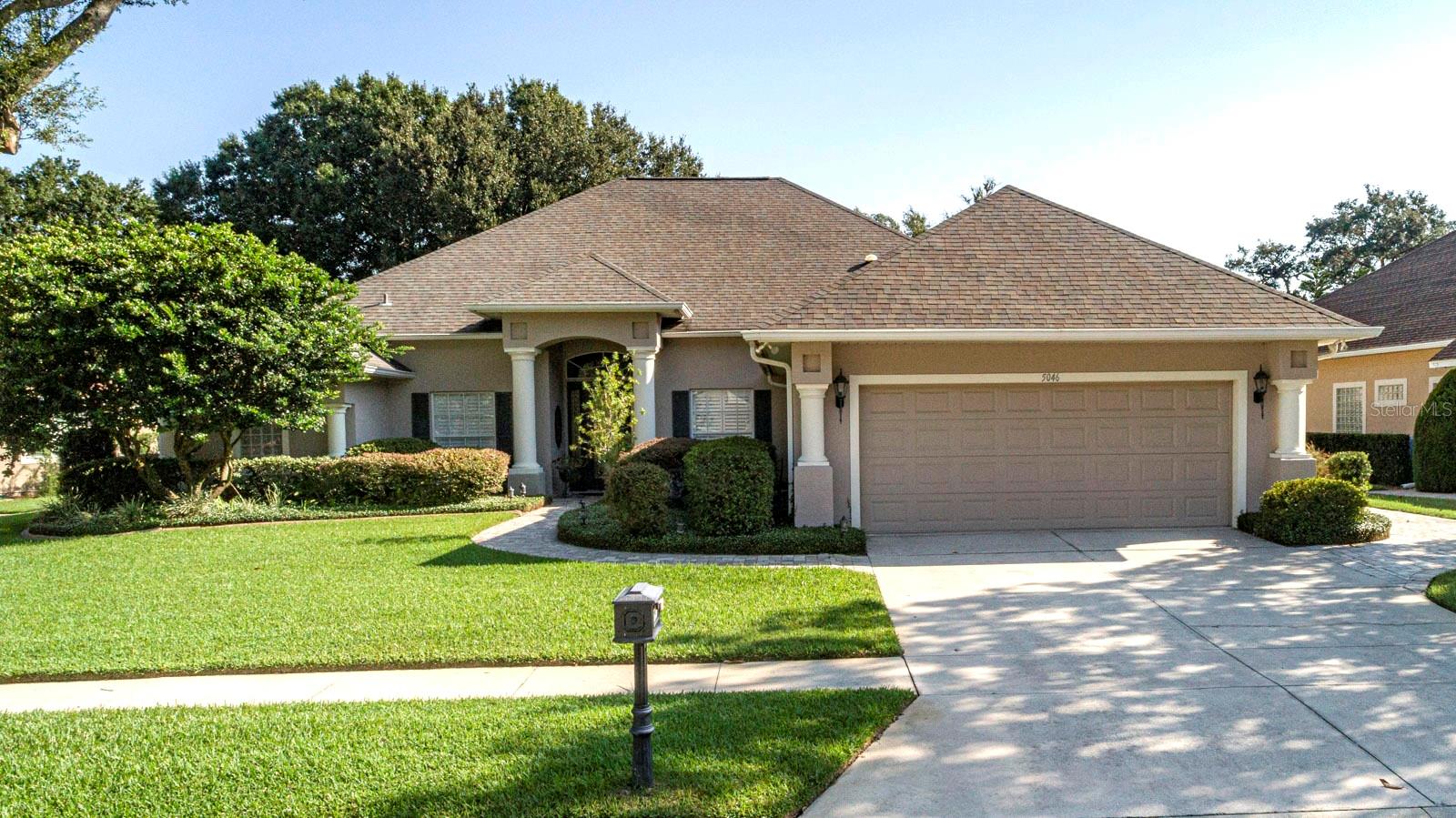 Serene Golf Course Living in the Heart of Mount Dora --- Welcome to this beautifully maintained home in the desirable Greenbriar Trail neighborhood of The Country Club of Mount Dora. Designed for comfort, space, and easy living, this single-story residence is perfectly suited for those entering retirement or seeking a relaxed, active lifestyle. From the moment you arrive, a cobblestone walkway shaded by a stately oak tree welcomes you inside, where nearly 2,700 square feet of thoughtfully designed living space awaits. Expansive windows throughout the home offer sweeping views of the 12th fairway, a peaceful pond, and the natural beauty of Florida’s landscape, creating a sense of serenity from nearly every room. The layout includes a spacious living room and formal dining area, a cozy family room with a gas fireplace, and an open kitchen featuring tall wood cabinetry, a center island, walk-in pantry, and a sunny breakfast nook overlooking the greens—perfect for relaxed mornings or casual entertaining. The private primary suite offers a quiet retreat with patio access, a luxurious bath with dual vanities, a jacuzzi tub, walk-in shower, makeup station and an oversized walk-in closet. Two guest bedrooms on the opposite side of the home, along with a charming guest bath, provide comfort and privacy for family and friends. A large laundry room adds practical convenience, with space for an extra fridge, desk, and storage. Additional highlights include plantation shutters, abundant closet space throughout the home, and large storage room with workbench off the lanai. An oversized two-car garage with utility sink, storage cabinets, and a separate golf cart garage with a workbench provide room ideal for golf enthusiasts or hobbyists. The expansive screened lanai is ideal for enjoying morning coffee, reading a good book, or dining outdoors while taking in the peaceful surroundings. Living in the Country Club of Mount Dora offers more than just a home—it’s a lifestyle. Optional membership gives access to golf, tennis, pickleball, a large pool, and year-round social events. The charming historic downtown, just minutes away, is filled with boutique shops, dining, and popular festivals. Plus, with Orlando and its international airport less than an hour away, travel and city conveniences are always within easy reach. This exceptional home offers the perfect blend of comfort, beauty, and lifestyle. Whether you’re seeking a peaceful retreat or an engaging community to call home, this property delivers. Schedule your private showing today and experience the best of Central Florida living.