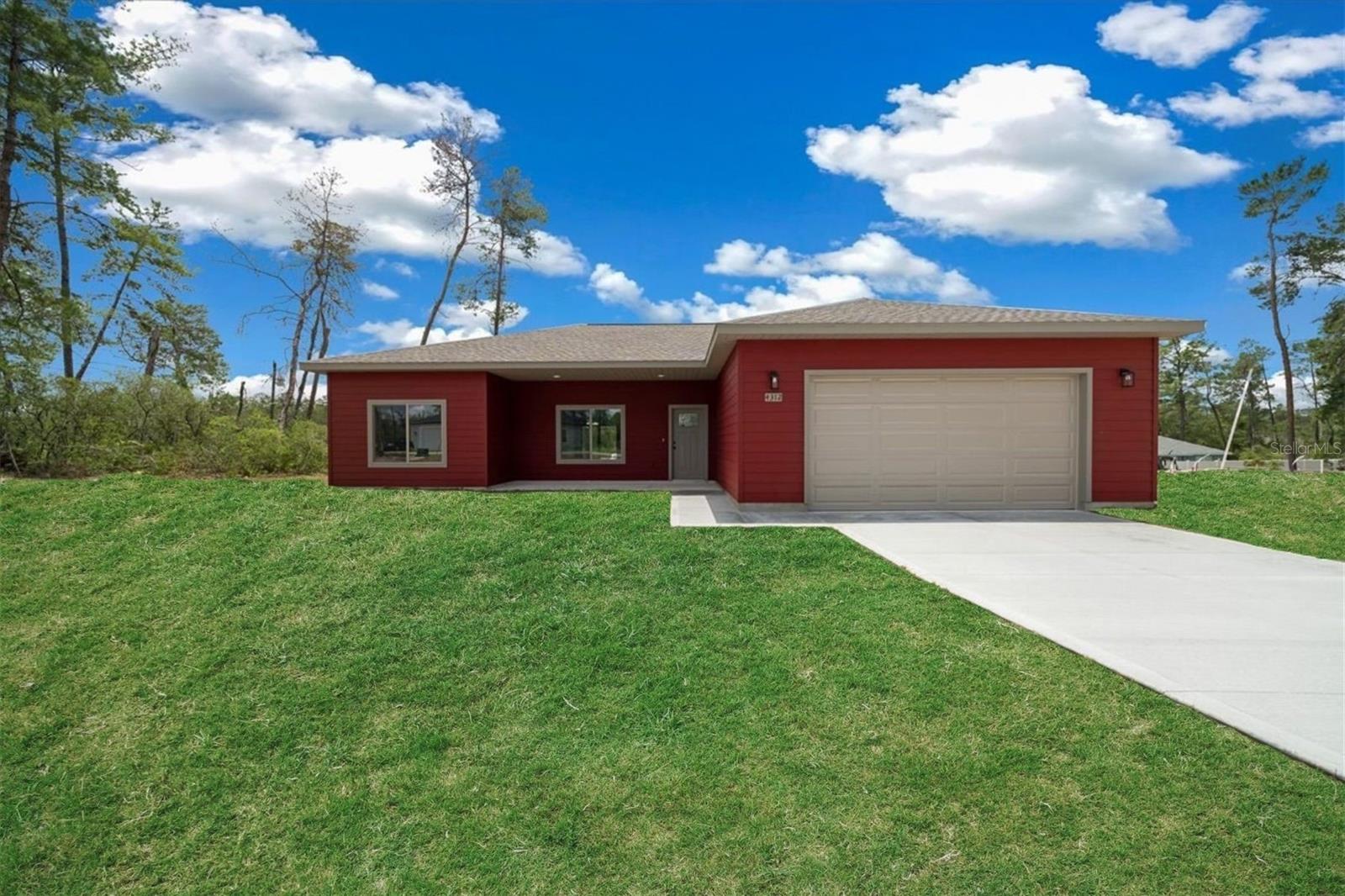 Under Construction. This home is being built to mirror the stunning property pictured, offering the same thoughtful design and high-end finishes, on a desirable oversized 0.38 acre lot!
With its bold red exterior and crisp trim, this one-of-a-kind new build is anything but ordinary. Inside, soaring 10 ft ceilings, oversized Pella windows, and luxury vinyl flooring create an airy, light-filled space. The open living and dining area flows seamlessly into a chef’s kitchen featuring custom solid wood cabinets with soft-close doors, quartz countertops, a soft-toned backsplash, large storage island, and dreamy walk-in pantry with wood shelving and motion lighting. Stainless steel refrigerator, range, microwave, and dishwasher are all included.
The spacious primary suite boasts a spa-like bathroom with dual quartz vanities, a massive porcelain-tiled walk-in shower with bench, and a generous walk-in closet with custom shelving. The secondary bathroom includes a polished porcelain shower/tub combo. Additional highlights include a stylish indoor laundry with custom cabinetry, quartz-topped sink, and folding area.
Oversized 36-inch doors enhance accessibility throughout. Outdoor living is easy with both a large covered front porch and a rear covered patio (with ceiling fan). The oversized 2-car garage includes a side entry door and opener.
Built with care and loaded with upgrades, this home is anything but cookie-cutter. Schedule your showing today!