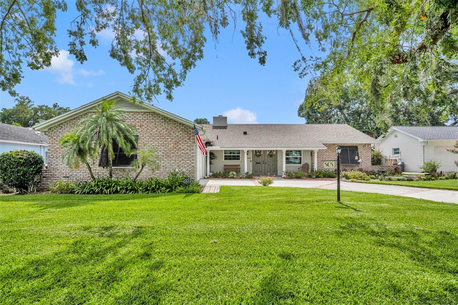 This beautifully updated 4 bedroom, 3 bathroom home offers a perfect blend of modern upgrades and charm, situated in the highly sought-after Dommerich neighborhood. No detail has been overlooked in this move-in ready property, with all major systems having been replaced, including: 2023 AC, 2019 roof, replumbed with PVC, new hot water heater, & upgraded electric panel. The open floor plan has a spacious master suite addition by NuDesign, created for ultimate comfort. The renovated kitchen has white cabinetry, sleek GE stainless steel appliances, and granite countertops that seamlessly complement the oversized pantry wall. The kitchen flows into a versatile family room (currently used as a dining room by the owners). The heart of the home is the formal living room featuring a brick wood-burning fireplace and French doors that lead out to the covered patio and screened saltwater pool—ideal for relaxing or entertaining year-round. Enjoy a spacious deck with pavers and plenty of room for lounging. The floor plan includes the original 3-bedroom, 2-bath layout + master suite expansion, offering a sitting space, large walk-in closet, and a spacious bathroom with glass shower. French doors lead out to the pool area, extending the living space to the outdoors. Additional features include wood flooring in all bedrooms plus living/family rooms, updated tile in the kitchen/dining rooms, hurricane shutters and plantation shutters, new double-paned windows, and freshly painted exterior in 2023. This home is connected to sewer, and the cast iron waste lines were coated in 2023 with a lifetime, transferrable warranty for the new owner. Great, convenient location, walking distance to Dommerich Elementary and Maitland Middle School, and zoned for Winter Park High School.