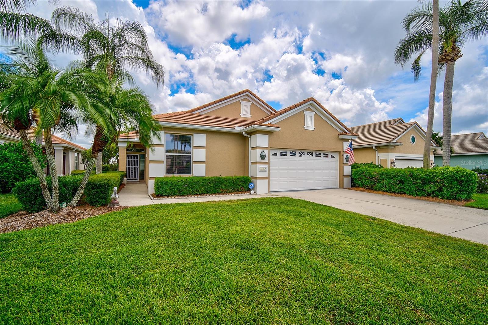 MOTIVATED SELLER! Bring All Offers! Updated Pricing Offers EXCEPTIONAL Value! INTERIOR FRESHLY PAINTED – April 2025 | NEW ROOF – May 2024. Welcome to this beautifully maintained 2BR/2BA + Den patio home located in the desirable Peridia Isle community—offering serene LAKEFRONT views and a thoughtful split-bedroom layout. The interior has been recently updated with fresh paint in several rooms, creating a cohesive and modern color palette. Enjoy peace of mind with a NEW TILE ROOF installed in May 2024. Inside, the home features high ceilings, plantation shutters, and abundant natural light throughout. The primary suite is located at the back of the home, offering privacy, a bay window sitting area, dual sinks, a walk-in shower, separate jacuzzi tub, walk-in closet, and additional windows for a bright, airy feel. The guest bedroom and full bath are located at the front of the home, with a den/office conveniently situated in the center. The kitchen includes a breakfast bar and a separate eat-in space—ideal for casual meals or entertaining. The formal dining room showcases elegant columns and opens to a side lanai via sliding glass doors. From the living room, step into the extended, glass-enclosed lanai—fully air-conditioned and offering panoramic views of the entire lake. An indoor laundry room is located next to the kitchen for added convenience. This move-in ready home is a must-see for buyers seeking comfort, style, and low-maintenance living in a vibrant, well-kept community. Peridia Isle has reclaimed water for the sprinklers. Peridia Golf & Country Club offers an 18-hole Executive golf course, clubhouse with full-service restaurant & tiki bar, tennis, pickle ball, swimming pool, water aerobics, bowling leagues and so much more. Golf is pay as you play! $4,000 One Time Cap. Reserve, $877 Qrtly Master Assoc, $450 Annual food/beverage, $455 Quarterly Yard Care, $250 One Time App Fee.