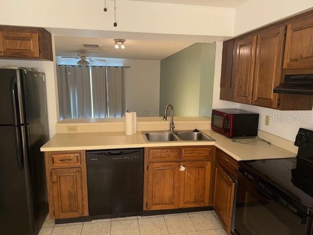 Photo of 13960 Fletchers Mill Drives, Tampa, FL 33613 (MLS # TB8429696)