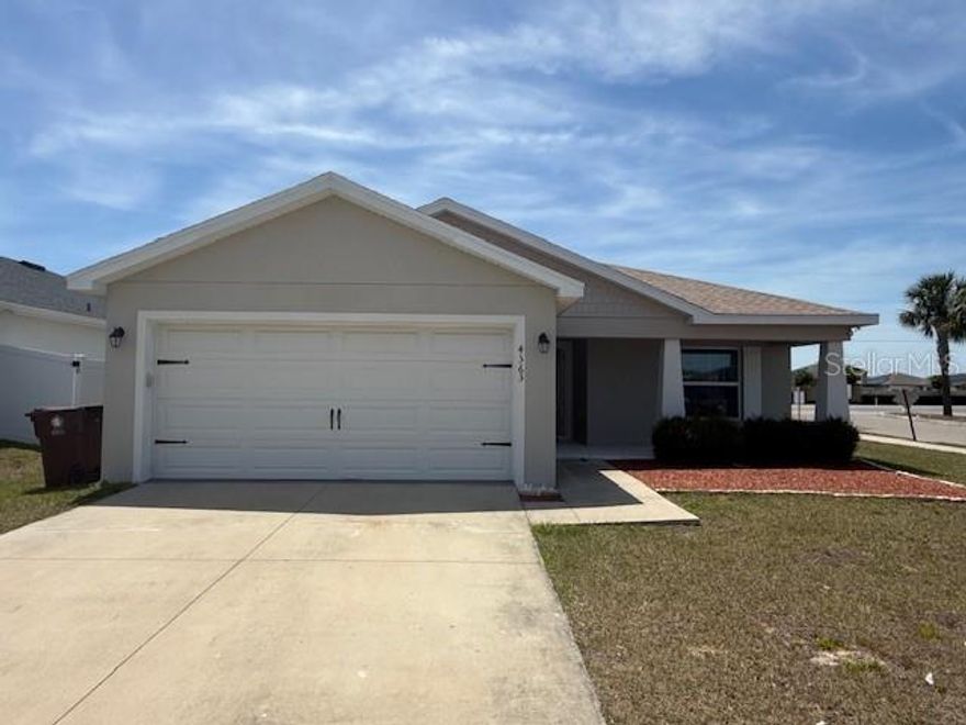 Welcome to this beautiful open concept home with 3 bedrooms, 2 baths, living room and dining room combo. You will be impressed with the high ceilings, spacious kitchen with walk-in pantry and stainless-steel appliances. The comfortable master bedroom is in the back of the home with amazing view to the backyard. This suite has walk-in closet and bathroom with two sinks, tub with separate shower, privately enclosed toilet area and linen closet. Bedroom with a front facing view ideal for a home office, media room, or playroom. The huge patio and cover - screened lanai space will give you the opportunity to enjoy with your family the excellent weather of Florida. Residents enjoy community amenities including a pool, playground and walking trails. Great Opportunity to join this exquisite area located minutes away from US-27 road for easy access to I-4 highway, restaurants, pharmacies, hospital, medical offices, mall and supermarkets. This exceptional home combines comfort, elegance, and location — the perfect place to call home.