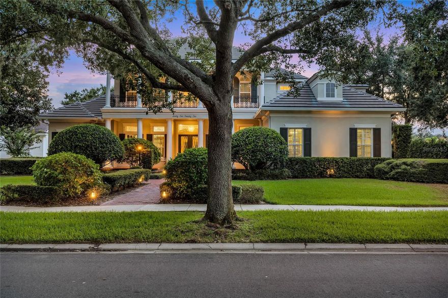 Prepare to be inspired by this Georgian-style estate, deep inside the sought-after Windermere neighborhood of Keene's Pointe. With elegant touches and major upgrades throughout, this home is truly a dream come true. With over 6,000 sqft, this 5 bedroom, 5 bath home offers a spacious yet inviting layout that draws you in from the moment you step through the stately double doors. As you enter the home, your eyes are drawn through the formal living and towards the backyard, with stunning natural light and whisps of the golf course views. At the heart of the home is a perfectly curated living and kitchen space, with a family room that offers a gas fireplace, sweeping windows, and plenty of room to entertain. The refreshed chefs kitchen offers plenty of counter space, prep-sink in the island, pendant lighting, custom hood, and an oversized walk-in pantry. The main level primary suite offers an impressive retreat with dual walk-in closets, soaring ceilings with detailed crown molding, lanai access, dual sinks over marble counters, large soaker tub, and an oversized shower. Other first-level features include a wine room adorned with brick and wrought iron, wet bar connecting the formal dining and kitchen, private office with wood-paneled walls and stunning chandelier, guest suite with an updated bath, and a game room with vaulted ceiling and craftsman level finishes throughout. The second floor offers a home theatre w/ inwall sound and blackout curtains, jack-and-jill bedrooms with a balcony overlooking the tree-lined street, and an enchanting guest suite with golf course views, walk-in closet, and a stunning bath with marble tile and frameless shower door. Your new backyard escape offers a saltwater pool/spa, covered lanai with automatic rolldown screens, and a well-appointed summer kitchen. Significant recent upgrades include a slate tile roof (2019), newer AC units, doors and windows (2023), exterior paint, and so much more. Enjoy all that Keenes Pointe has to offer with two 24-hour manned gates, lake access, pool and recreation areas, basketball court, playground, nature paths, and a recreational vehicle/boat storage. Golf and social memberships to the Golden Bear club are also available! Be sure to view the full virtual tour and call to set up a private showing today!