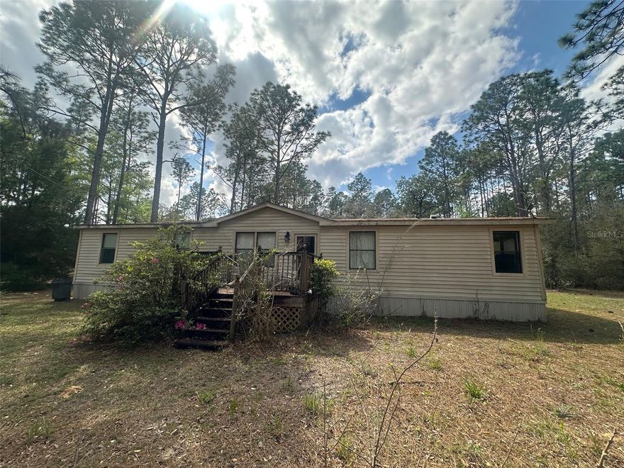 Huge Potential!

Opportunity knocks with this spacious 3-bedroom, 2-bath plus den manufactured home on over 2.2 acres in the serene Lake Tropicana Rancherias community of Dunnellon. Featuring high ceilings, a covered porch, and a fully fenced yard, this property offers plenty of space to spread out, enjoy the outdoors, and create your dream home.

Inside, the home boasts an open layout filled with natural light and a versatile den perfect for an office, media room, or play area. While the property needs some TLC and updating, it presents a rare opportunity for a handyman or investor to add significant value.

The fenced yard ensures privacy and safety for pets or children, while the expansive acreage provides endless possibilities for gardening, outdoor hobbies, or entertaining. Adding to the appeal is a 12x24 shed with electricity, ideal for a workshop, storage, or creative projects.

Priced to sell, this home is ready for someone with vision and ambition. With a little work, you can transform this property into a beautiful, comfortable, and personalized retreat. Don’t miss your chance to own a slice of peaceful country living in Dunnellon with tremendous potential!

Bring your tools, creativity, and imagination—this home is a blank canvas waiting for your personal touch!