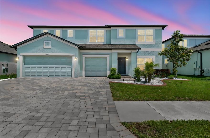 One or more photo(s) has been virtually staged. Welcome to the one you've been waiting for. Tucked behind a conservation area with sweeping pond views and zero rear neighbors, this stunning MI built Dali Floorplan at 3292 SF has 5-bedrooms, 3 full bathrooms, 3 car garage home in the highly sought-after Talavera community delivers the Florida lifestyle you've been dreaming of — without the wait. From the moment you walk in, the difference is clear. Gorgeous laminate flooring flows through every room on both levels — no carpet, no compromises. The home is completely move-in ready with a full appliance package, water softener, and whole-home water filtration system already in place. Every detail has been handled for you. Outside, a spacious 3-car garage and oversized paver driveway give you all the room you need, while the fenced backyard and covered patio create the perfect setting for weekend gatherings or quiet evenings watching the sunset over the water. Talavera isn't just a neighborhood — it's a lifestyle. Enjoy resort-style amenities including a beach-entry pool, splash pad, clubhouse, tennis, basketball, and pickleball courts, plus a golf-cart-friendly community that hosts weekend food trucks and neighborhood events year-round. Zoned for Land O' Lakes High School and its prestigious IB program, and minutes from the Veterans Expressway, SR-52, US-41, and Tampa International Airport — location simply doesn't get better than this. This one checks every box. Come see it before someone else does.