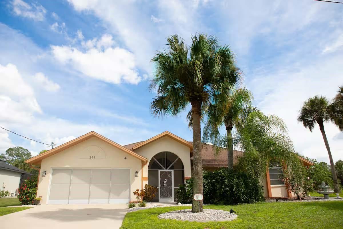 Beautifully updated pool home with Gulf access and just 10 minutes to open water. This 3-bedroom, 2-bath residence features a split floor plan with an open kitchen including solid wood raised-panel cabinetry, granite countertops, glass tile backsplash, stainless steel appliances, and a convenient pass-through to the lanai. The primary suite offers two walk-in closets and a spacious bath with double sinks, a walk-in shower, and a garden tub. Sliding glass doors from the primary bedroom, dining room, and dinette open to the 13x35 screened lanai, refinished heated pool, and views of the Apollo Waterway. All bedrooms have walk-in closets, and the second bath also provides pool/lanai access. Outdoor features include a 78x13 paver patio, 22x8 dock with recently wrapped pilings, and a 4,500-lb covered boat lift. The home has been well maintained with key improvements including an A/C system and complete overhead repipe (both in 2018), along with a whole-house surge protector, garage screen doors, and updated lanai ceiling fans. This extensively updated home is move-in ready and ideal for waterfront living.