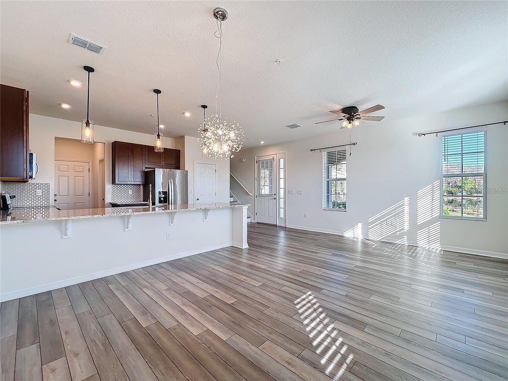 Photo of 10001 Eagle Rock Alley, Orlando, FL 32832 (MLS # O6416015)