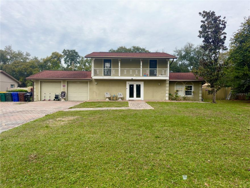 FANTASTIC LOCATION IN THE HEART OF KISSIMMEE!  This 4 bedroom, 3 bath home features 1,950 square feet of living area with 2,792 total square feet under roof.  First floor features include living room/dining room combo, kitchen with eat in dinette,  primary bedroom suite and a bonus room (now being used as a bedroom).  Laundry is in the garage along with a storage room.  Second floor features 3 bedrooms and a full bathroom.  There is a balcony in the front and back of the home accessible from the 2 story.  The lot is an oversized nealy 1/2 acre with a fence.  NO HOA!  Call today to make an appointment to see this awesome value.