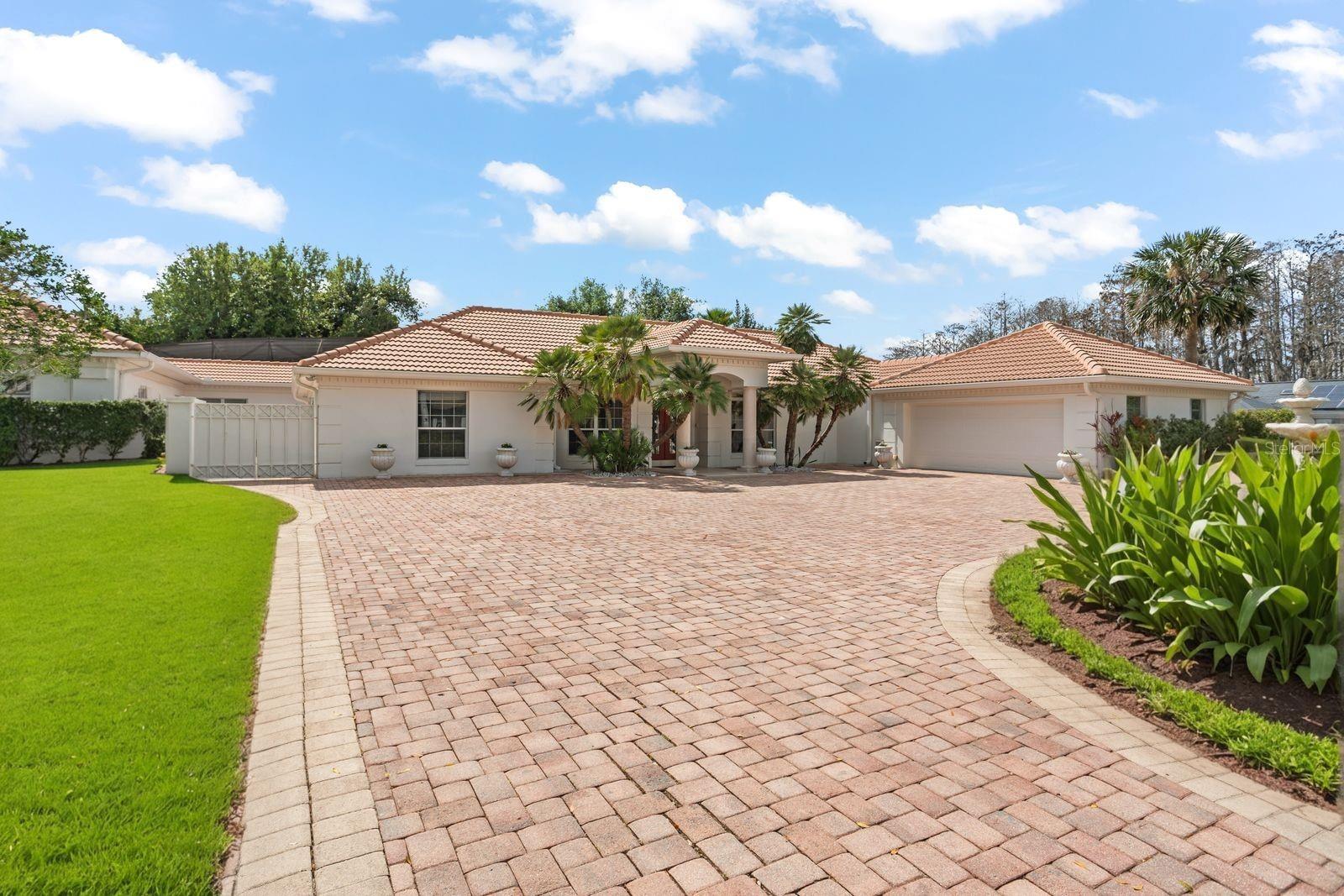 One or more photo(s) has been virtually staged. Nestled within the iconic Bay Hill community, this Mediterranean compound presents an unparalleled value in today's luxury market. With a separate in-law suite and renovated main house, this estate is designed for an elevated lifestyle. Everything about this property is grand starting with the foyer and continuing with vaulted coffered ceilings and elegant travertine floors that lead seamlessly into the open floor plan, bathed in natural light. The gourmet kitchen will delight the Chef in your family with massive granite waterfall island that comfortably seats eight. 42" custom cabinetry, sleek contemporary design, Sub-Zero refrigeration, double dishwashers, gas cooktop, a hooded range, and sweeping 180-degree views of your private pool oasis. The private primary suite is the epitome of luxury, featuring an expansive sitting room, a personal office, a fireplace, a spa-like en-suite bathroom, and a custom-designed, sparkling walk-in closet, complemented by a dedicated laundry room and dressing room. Two additional guest rooms, each with an en-suite complete the footprint of the main house. Moving to the East wing of the property, you'll discover the ultimate in luxury living with your own private fitness studio, theatre/game room, additional laundry, and private office. With an open design of functional suites, the East wing is perfectly suited for a mother-in-law suite and the yoga or fitness studio you've always envisioned. Car enthusiasts and RV owners alike will revel in the heated and air-conditioned RV garage, boasting an expansive (65’ long, 25’ wide, 16’ high) space for up to eight vehicles, complete with water drainage, EV charging, and full power hookups. The resort-style property is an entertainer's paradise, complete with an indoor pickleball court, a 9-foot-deep resurfaced pool, a full summer kitchen, a pool house, and a custom-engineered screen enclosure with uninterrupted views of lush landscaping. Additional features include a whole-house generator and a multi-zone surround sound system, ensuring total comfort and peace of mind. This property is more than just a home; it's a legacy estate designed to bring generations together under one extraordinary roof. This unique property delivers a resort-like ambiance in one of Orlando’s most coveted locations. Enjoy the many amenities that a private Bay Hill membership offers, including golf, tennis, pickleball, a fitness center, a pool, a marina, dining rooms, lounges, meeting and banquet facilities, and numerous social and recreational events. This property offers unparalleled convenience, located just minutes from Universal Studios Orlando, Restaurant Row, Disney's Hollywood Studios, Volcano Bay, shopping, and 20 minutes to the Orlando International Airport, Disney, and downtown Orlando.