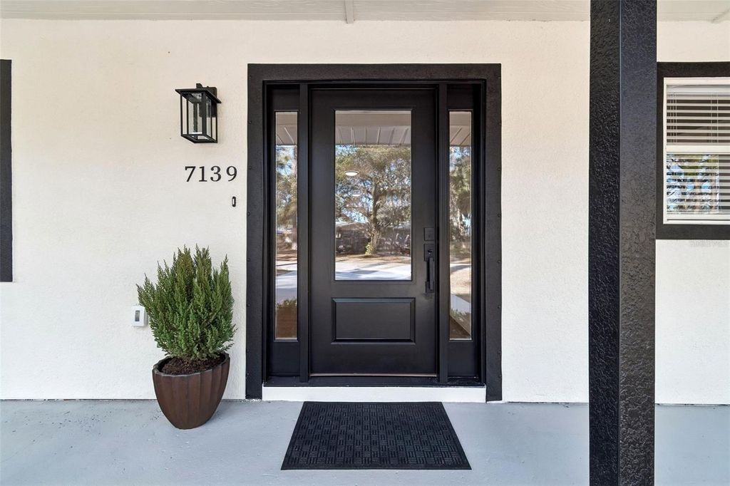 Photo of 7139 Pinewood Drive, New Port Richey, FL 34652 (MLS # TB8477591)