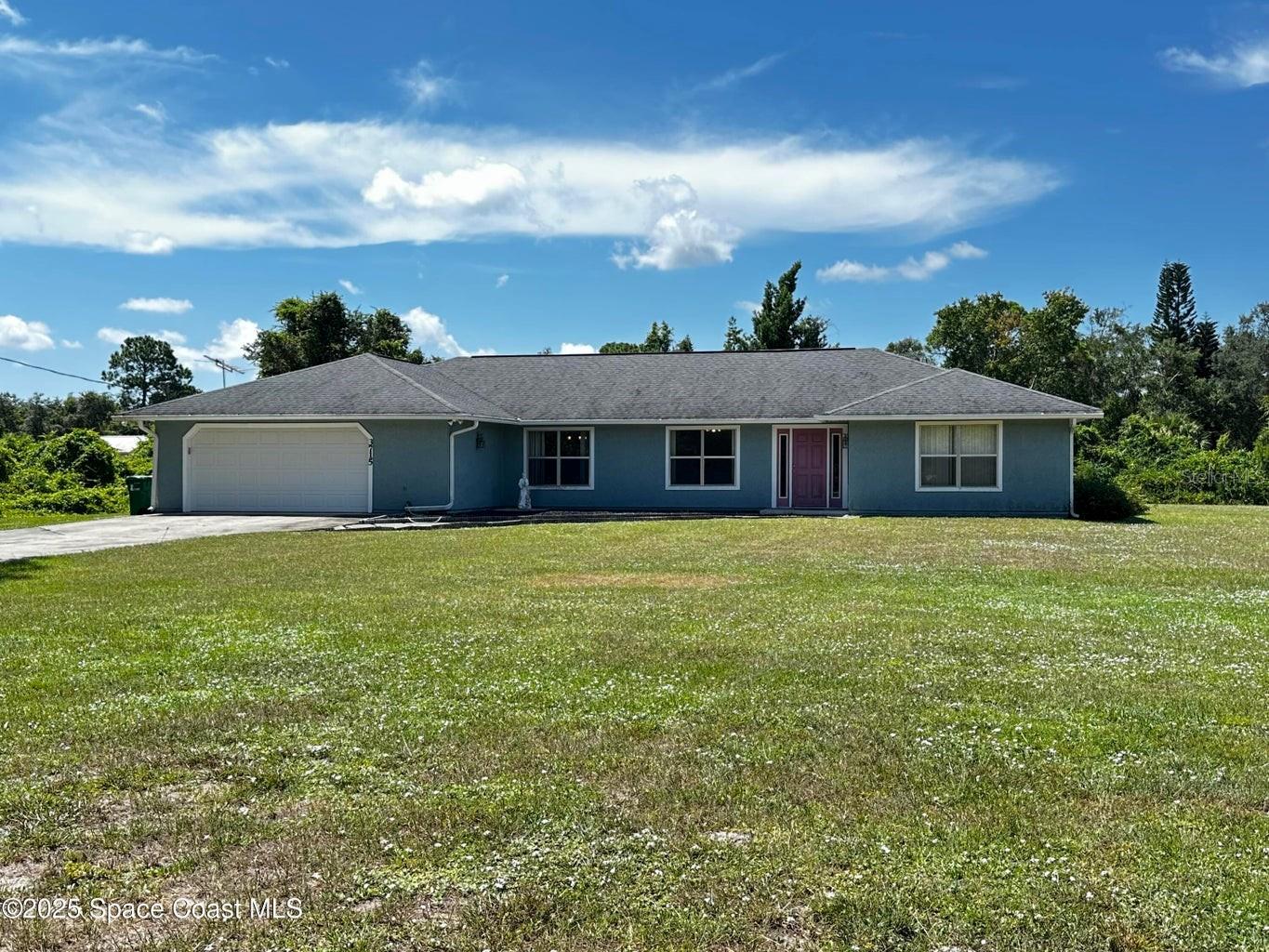 Endless Potential on a 1-Acre Estate in Canaveral Groves! This spacious property truly has great bones and offers incredible potential to bring your vision to life! Nestled in the heart of Canaveral Groves, this 1-acre estate provides ample room both inside and out. Inside, you'll find an abundance of space just waiting for your personal touch. The large family room boasts a gorgeous Stone Fireplace. Whether you're looking to renovate, redesign, or build out your dream layout, the possibilities are endless. Recent updates add value and peace of mind, including: Brand New Garage Opener (2025), New Roof (2018), New A/C Unit(2020), Blown-In Insulation Added (2024) helping keep the home cool and energy-efficient year-round Don't miss this rare opportunity to own a large parcel with so much potential in a desirable location. Come see it for yourself and imagine the future you can create here!