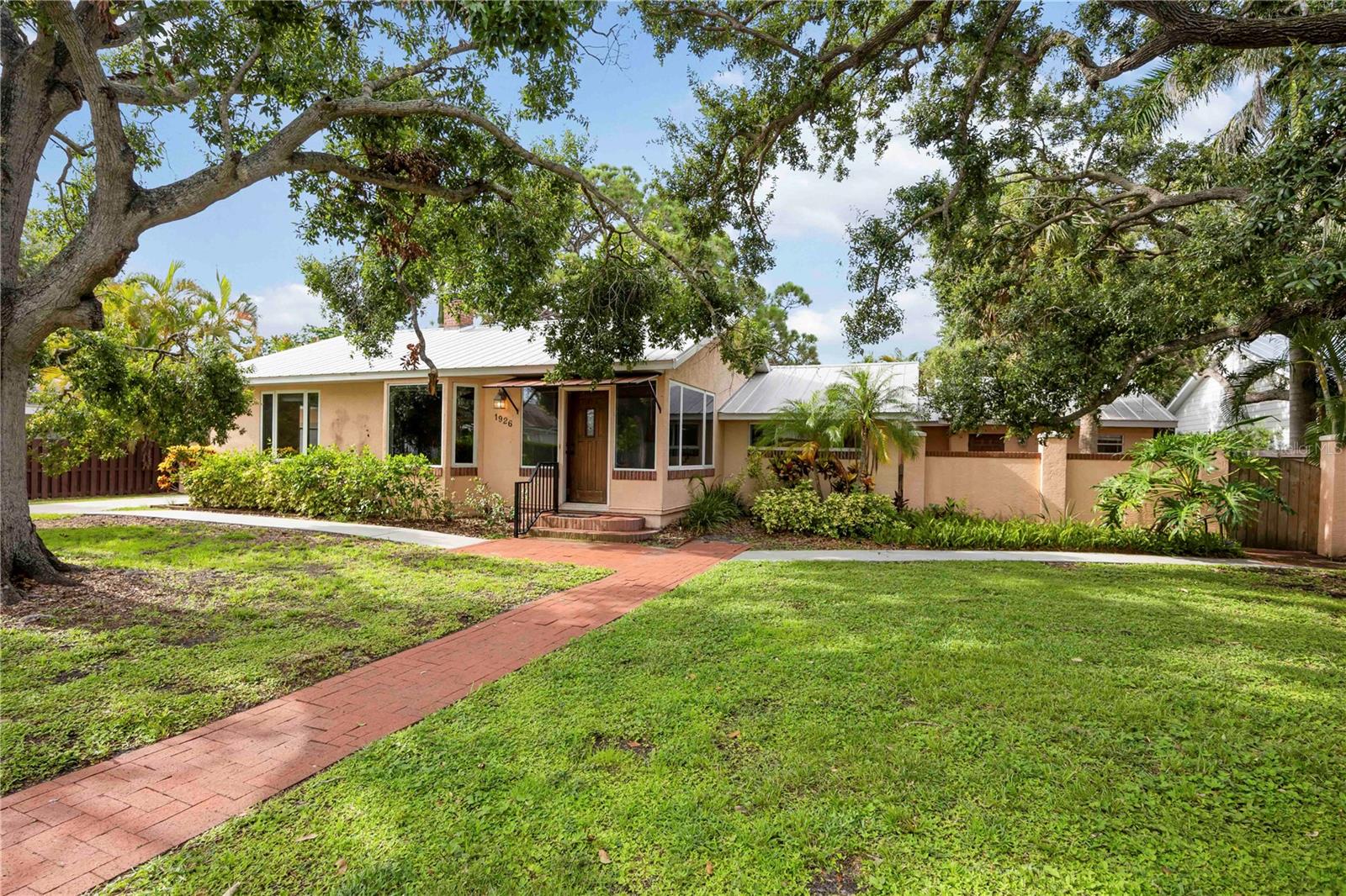 Rare West of the Trail home! Discover the perfect blend of vintage charm and modern convenience in this delightful home with an attached garage on a double lot. Known for its prime location, this home is ideally positioned between the world renowned Siesta Key beaches and minutes to the vibrant cultural hub of Downtown Sarasota, offering you the best of both worlds. Highlights include Metal roof for durability and peace of mind. Updated kitchen with granite countertops, stainless appliances and excellent storage. This property is Not in a Flood Zone. Step outside to your tropical oasis: private screened lanai and tropical landscaping. Adding more value is the "flex" space, complete with kitchenette, private bath, laundry area, screened porch and private entrance. This versatile space is ideal for visitors, a creative art studio, potential rental income, separate in-law quarters, a caregiver's suite or a home office. Conveniently located near Southside Village, Sarasota Memorial Hospital, shopping, top rated schools, this home is perfect for families, investors and professionals alike. Don't miss your opportunity to own in one of Sarasota's most established and sought-after neighborhoods. Schedule your showing today!