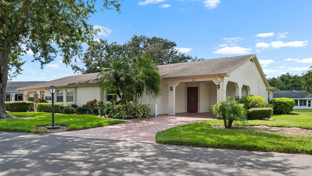 This partially FURNISHED 2-bed, 2-bath condo in the active and engaging 55+ community of Kings Point could be "the one" for you! With a BRAND NEW ELECTRIC PANEL (09/2025) and HURRICANE RESISTANT WINDOWS, this home comes with peace of mind. There is an attached carport with driveway for tandem parking, and it's located on a CUL-DE-SAC for added seclusion. Feel welcomed inside by the spacious Great Room with dining and living areas, a Family Room, and a fully enclosed FLORIDA ROOM with tinted windows for year-round enjoyment regardless of weather conditions! The kitchen features a BREAKFAST BAR, a pass-thru window to the Family Room, and connects to the Laundry Room with a washer and dryer. Between its ample storage space and access to both the carport and kitchen, this room would also make a great mudroom! Travel down the hall to the Primary Bedroom to find a WALK-IN CLOSET and EN-SUITE BATHROOM complete with a single sink vanity and shower stall! The secondary bedroom is tastefully appointed and only a few steps from the second full bathroom, featuring a single sink vanity and tub/shower combination. Kings Point is a bustling gated and golf cart friendly community known for a myriad of recreation facilities, indoor/outdoor heated pools, a state-of-the art fitness center, arts, crafts, tennis, pickle-ball, lawn bowling, auditorium with 800+ seating and over 200 clubs & activities. Begin the process of making this home your personal paradise by scheduling your showing today!