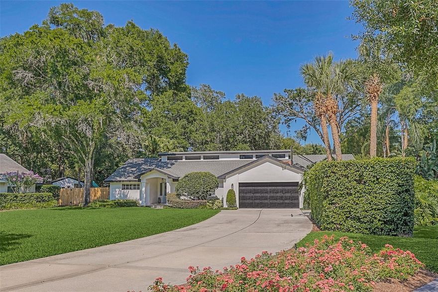 A rare opportunity in the Vias of Winter Park to own .63 of an acre in a secluded cul-de-sac framed with mature oaks and landscaping. This home has been carefully renovated and stretches nearly 4,000 square feet on mostly one-level living making daily function effortless for today’s modern family. Five-bedroom four-bath home with split living bedroom plan, formal living and dining spaces and large open kitchen gathering space that spills into the covered porch and outdoor living and pool area. Kitchen has been completely redesigned with beautiful custom cabinetry, quartz counters, a spacious island for gatherings and preparation, light and bright finishes, and custom backsplash. The kitchen blends family space with custom milled bookcases providing terrific storage with views through glass doors and transom windows that lead to the outdoors and allowing beautiful ambient light through the house. Primary suite is in its own wing of the home for incredible privacy. This suite also features large closets, a large primary bath with double sinks and a seamless glass shower with marble porcelain tile accents for a clean and timeless look. Other bedrooms enjoy a split plan and are nestled on the other side of the house. With fully renovated baths, this home is ready to move in. One of the bedrooms is currently being used as a den but generous enough to be a mother-in-law suite or designed to be a secondary primary. The outdoor spaces makes the house an incredible home for entertaining with its summer kitchen. The large Florida pool and spa and a backdrop of greenery encourage relaxation at the end of the day. Professionally landscaped and outdoor lighting create an oasis that is hard to find in the Vias. It is a prime location and unique opportunity to find a property of this size in old Winter Park! Walk to WPRC, community parks and near the ICC, Phelps Park and a YMCA, zoned for Dommerich Elementary, Maitland Middle and Winter Park High.