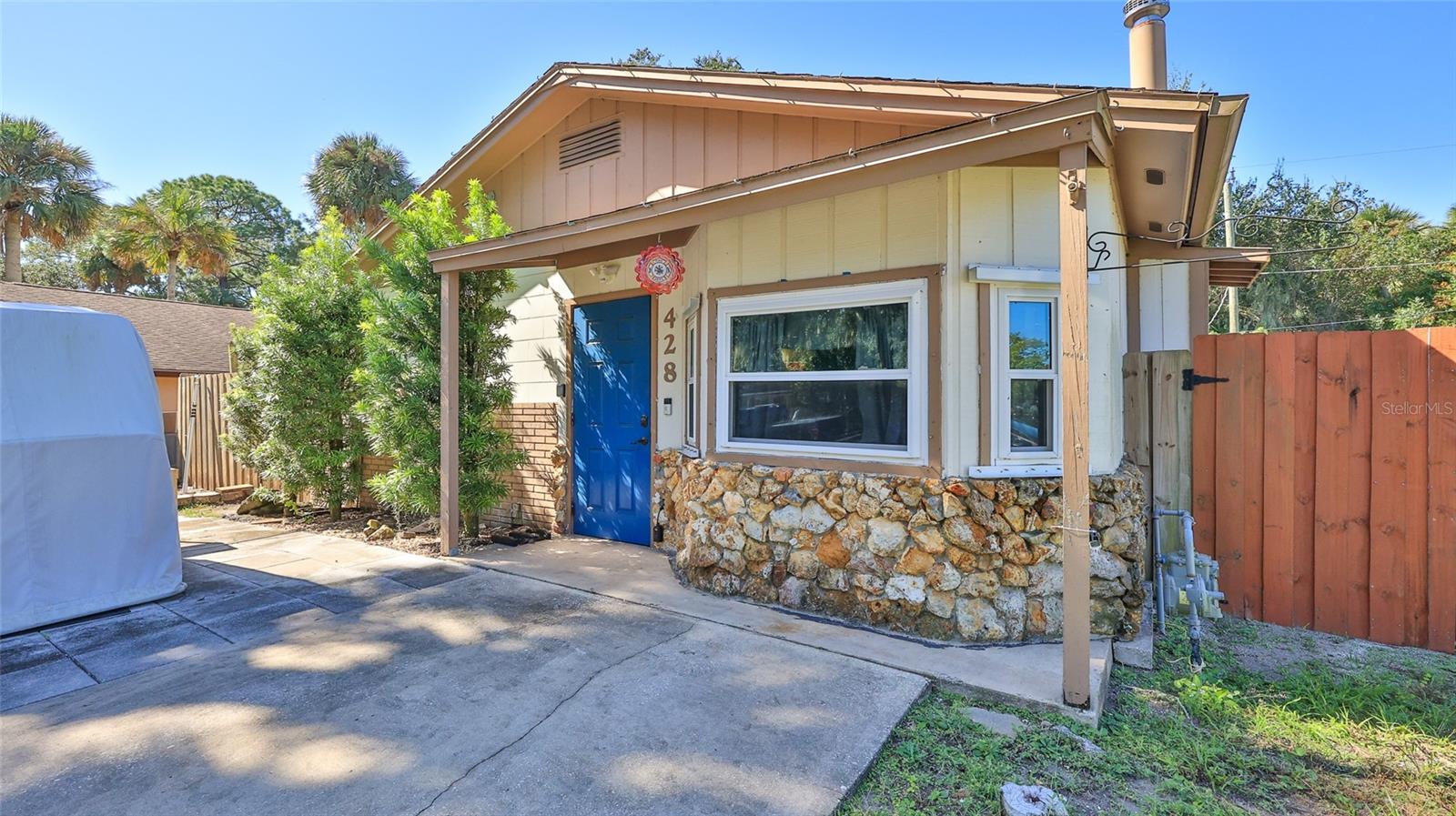 It's the perfect home for a first time homebuyer or a snowbird getaway!  This charming 3 BR concrete block home offers comfort, modern updates, & peace of mind....all in an X flood zone where the home has never flooded!   Step inside to a cozy living room featuring a beautiful stone, wood burning fireplace.  Updated eat-in kitchen with plenty of cabinets.  French doors with built in blinds lead to your relaxing screen porch.  Updated bathroom, ceramic tile & vinyl plank flooring throughout for easy maintenance!   Updates include newer double paned vinyl windows, updated electrical panel, 2019 AC, 2019 tankless natural gas water heater, & a whole house natural gas generator for year round reliability! Alarm system with no activation fee!   Fully fenced backyard offers privacy, 2 storage sheds (one with window AC & electric).   Convenient location close to shopping, restaurants, and the beach!  Welcome home!