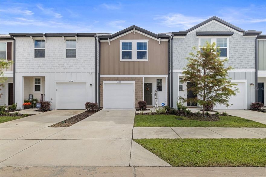 Welcome to your nearly new townhome in the quiet and welcoming Tyson Townhomes community. This beautifully maintained residence offers 3 bedrooms / 2.5 baths with approximately 1,600 sq ft of comfortable living space. Step inside to find gorgeous vinyl plank flooring on the main level, while upstairs the three bedrooms are carpeted for extra comfort.

At the heart of the home, the kitchen offers abundant cabinet storage, generous counter space, and an open design that makes cooking, family meals, or entertaining effortless. It flows seamlessly into the family room, where sliding glass doors lead directly to the backyard—perfect for indoor/outdoor living. A convenient powder room and direct garage access complete the first floor.

Upstairs, the spacious primary suite includes a walk-in closet and en-suite bath, while two additional bedrooms share a full bath. The washer and dryer are tucked away in a closet upstairs, offering added convenience right where you need it.

One of the biggest highlights of this home is its unbeatable location. Hercules Park is literally at the end of the street—just steps from your front door. This brand-new park features a walking trail, pond, playground, splash pad, picnic areas, and wide-open play fields, making it the perfect spot for an evening stroll, weekend picnic, or outdoor fun with family and friends.

In addition, this home is within walking distance of Woodland Elementary School, close to shopping, dining, and everyday conveniences, and offers easy access to everything the Tampa Bay area has to offer.