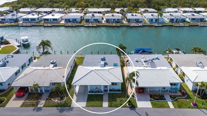 This must-see hidden gem on the north end of Longboat Key offers a quintessential Florida lifestyle. Waterview’s galore as you walk into your newly completed, renovated Florida paradise home, on a deepwater marina and canal, which epitomizes beauty and style. Boat lovers will want the location of this totally turnkey furnished 1,423-square-foot standalone two-bedroom, two-bath home, with your upgraded composite boat dock just 15 feet behind your villa. Completely remodeled, this home provides contemporary classic design features that create an open airy gorgeous living space. All new stainless appliances in 2026, air-conditioner 2025, roof 2019 and more. The open kitchen design with a large island, new quartz countertops, plenty of beautiful new cabinets with roll-out drawers and a contrasting white and gray classic color scheme. Great counter space makes the kitchen ideal for entertaining and enjoying the coastal casual lifestyle. Beautiful porcelain tile flows throughout the home, providing continuity from room to room. An oversized skylight in the great room with retractable shade provides lots of extra natural brightness. The large primary bedroom is complete with a fully refashioned en-suite bath with gorgeous granite countertops and custom-tiled shower. A spacious walk-in closet provides plenty of room for your coastal style wardrobe. The second bath mimics the maintained class and elegance of this home with granite counters and tiled shower. The lanai has been transformed into extra living space with a cozy study and separate office nook. The study is an ideal spot to curl up with a book or just sit privately and watch the beautiful white pelicans float by with dolphins and manatees alongside. This flexplace can also house extra sleepover guests. The double lanai facing the water allows a panoramic view and full access to your large, elevated brick paver patio and dock from floor-to-ceiling, impact-grade patio doors. Go outside to a private oasis that overlooks the wide-open canal, marina and bay views. Sit, dine, entertain or sunbathe while you enjoy the abundant wildlife from the comfort of your patio paradise, or hop in your boat secured to your 5-by-25-foot dock and head out to one of the many Longboat Key restaurants. Some of the best waters to explore in Sarasota for fishing, sandbar enjoyment, kayaking and swimming right in your backyard. You have direct access to the Intracoastal Waterway and a quick boat ride to the Gulf of Mexico. Impact windows and new hurricane-rated doors throughout. The Spanish Main maintenance-free community has a wonderful neighborhood feel with heated pool, deeded beach access, a 40-foot slip marina with social events galore, making every day feel like a vacation as you lounge in the sun poolside and enjoy the sea The deeded beach access is ideal for those numerous beach days and magnificent sunsets. Pet-friendly, maintenance-free, and an active 55-plus community are added benefits for your enjoyment. Only a short drive to fantastic shops and restaurants, including Anna Maria Island, plus cultural events Sarasota and St. Armands Circle have to offer. This villa has been fully renovated in compliance with FEMA standards due to hurricane flooding in 2024.