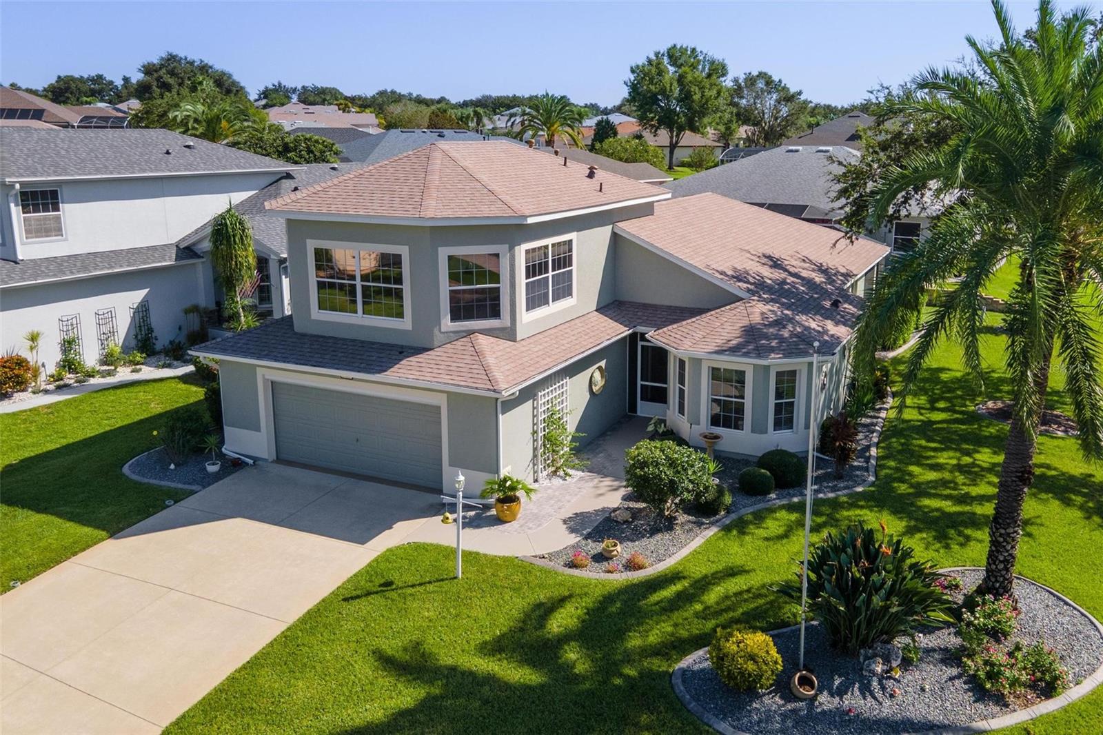 This gem is located on a beautiful, well landscaped corner lot, close to the lake and all of the wonderful amenities Royal Harbor has to offer. This home has great curb appeal, and is a must-see. It offers a great custom
design with many thoughtful upgrades and built-ins, extra storage, and has been meticulously maintained. Enter the home through a screened patio and a pretty leaded glass front door. Appreciate the open, bright and
airy feeling with volume ceilings and crown molding. The oversized Kitchen is sure to please, with lots of solid wood cabinets with pull outs, granite countertops, stainless steel appliances, cheery breakfast nook,
breakfast bar, and nice lighting for function and effect. It opens to the Living and Dining areas with beautiful wood floors, upgraded ceiling fan, and French Doors to the newly screened lanai and private, easy to maintain
back yard. Enjoy your patio with natural gas line for your grill. A great little space! Your spacious Master Suite has access to the lanai, a walk in closet, and nicely updated En Suite bath with double vanities, quartz
counters, and walk-in shower. The large second bedroom will welcome your guests in style and is adjacent to the nicely upgraded Guest Bath. And one of the greatest features of this home is the Fabulous Bonus
Room/Game Room/Office/Bedroom upstairs! You will absolutely LOVE this magnificent upstairs room. You decide how you want to use it. Great open space, wonderful large windows with thermo-blinds, great views (you
can even see the lake!), solid wood built-ins, walk-in closet, half bath, wet bar, and more. It even has its own A/C zone and control. And the Oversized Garage, with electric screen, has plenty of space for two vehicles
and lots of extra room for the workbench and storage. New Roof 2023, New HVAC 2025. Many upgrades. (see list in attachments) This home will not disappoint, and neither will the friendly 55 plus community of Royal
Harbor, with so many wonderful amenities and activities. There is even RV and Boat Storage. Come enjoy the lifestyle you deserve. Come home to Royal Harbor. Please call today for your private showing.