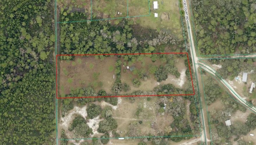 5.12 Acres A-1 Zoned Lot on a PAVED road (NE 130th Court Road) with paved road access all the way from town via 315 to NE 130th Court Road, mostly flood zone X, a very small part is flood zone A near the rear and edge of the property. The sky is the limit with this property, you can build a site built home, you could build a barndominium or even put a manufactured home on the site. A great parcel for someone who has some Animals - Horses, Cattle, Goats, etc. The property offers peaceful, country living, while being convenient to Ocala, Gainesville, Silver Springs. Enjoy all that the Ocala National Forest offers, great location for fishings, hiking, hunting and other outdoor adventures.