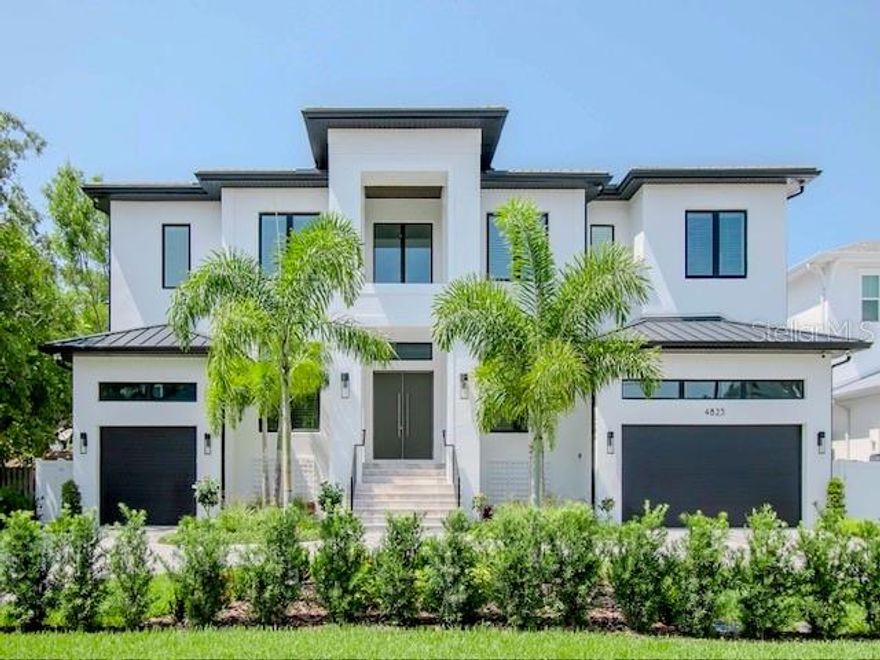 A Must-See Home! Visit the epitome of South Tampa luxury living in this 2023 newly constructed home w/original warranty. This beautiful home, in an optimal location, was designed & built w/superior workmanship & new building codes. Showcasing its true superiority, this home was unaffected by 2 hurricanes, staying dry during both storms. A true testament to its quality. Boasting over 6114 square feet, w/6 bedrooms and 6.5 baths, even a discerning family will find value in all the extras. A striking grand entry w/soaring doors & 24-foot ceilings will invite you into a world of refined luxury. This stunning home has everything and is guaranteed to impress. The home will grab your attention with the sophisticated and elevated design, top-of-the-line appliances, rich colors, and tasteful décor. The open floor plan flows w/ soaring ceilings, and expansive windows bathing the home in an abundance of natural light. The oversized PGT vinyl windows are also impact-resistant and energy-efficient.  The main floor boasts a separate Formal Dining room, Executive Office (w/French doors), Great room, Kitchen, Butler’s Pantry, Laundry room and ample storage. A private Guest/Nanny suite/ Flex room with an en-suite bath is on the opposite side of the home allowing complete privacy. The Gourmet Chef Kitchen is equipped with European-style maple cabinetry, Calacatta quartz counters, a 72" Subzero fridge, and top-tier Wolfe and Miele appliances, and Butler’s pantry w/ arched walk-through to Kitchen & wine fridge plus eat-in Breakfast Nook. The Great room overlooks the pool and features a gas fireplace and coffered ceilings, custom wood shelving, impact sliding doors which lead to an expansive outdoor Lanai, built for entertaining or just quiet family evenings. French doors lead from the Lanai back to the main floor Guest/Nanny bedroom w/en-suite bath. This home is designed to easily accommodate a variety of living arrangements and lifestyles. The custom wide wood staircase invites you to the elegant 2nd floor w/ large additional Living area/Bonus room w/ wet bar, professional Workout room (seller can remove padded flooring), 2nd Laundry room, and 5 spacious Guest Suites. Retreat to your private Master Wing on the 2nd floor, featuring a tray ceiling, balcony, luxurious bathroom w/ double sinks, soaking tub, and an impressive 250 sq ft master closet w/ custom shelving & island. Access to the Elevator from all floors seamlessly connects each level to the Garage below, ensuring convenience and accessibility. There are two his/her Garages w/ a total of three spacious spots, leaving room to investigate adding lifts. The backyard is a true oasis w/ large travertine lanai and pool deck, Outdoor Kitchen w/ gas grill, saltwater pool, heated spa, waterfall feature, outdoor fireplace all enclosed in a new pool cage. This home spared no expense w/ beautiful hardwood, two-story block construction, hurricane impact windows, and high-end finishes throughout including 8’ solid core doors, hurricane impact windows & doors, tile/aluminum roof, and wiring for surround sound & security. Situated in a prestigious neighborhood in South Tampa, this custom-built home is the epitome of luxury plus prime location close to renowned shops, restaurants, entertainment, stadiums, 2 airports, I-275 to beaches, and I-4 to Orlando. Located in the prestigious Mabry/Coleman/Plant public school district and close proximity to sought after private schools. A must-see!