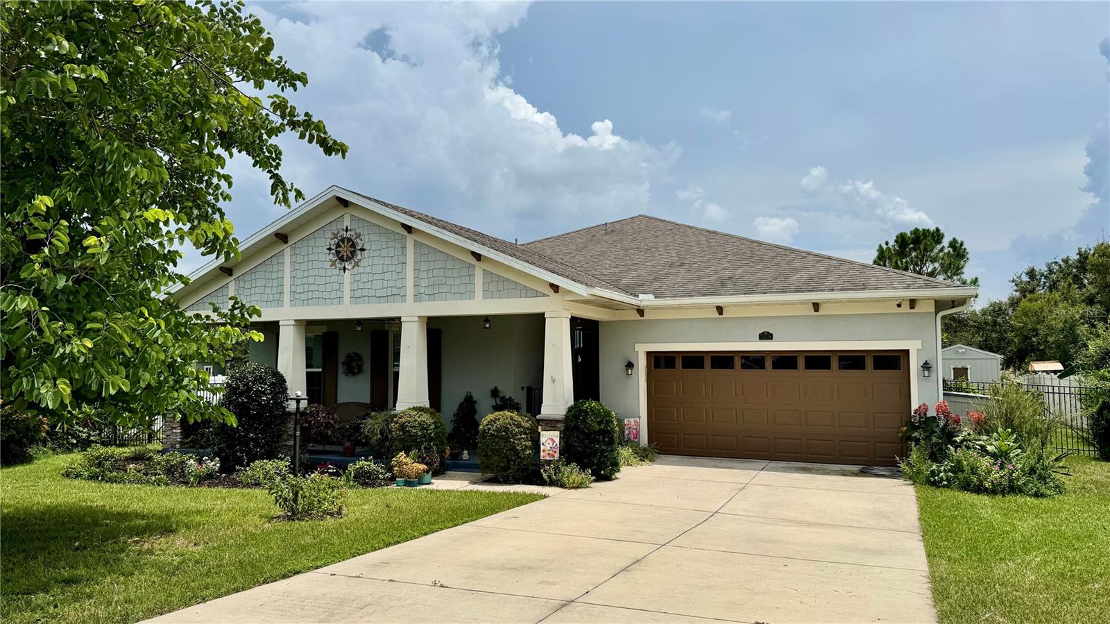 Welcome Home to beautiful Windy Ridge! This one owner home is nestled on a spacious and beautifully landscaped nearly 1/2 acre lot! Step inside to find a warm and inviting floor plan featuring a large living area features a beautiful tray ceiling with beautiful tile floors and opens up to the well appointed kitchen with modern appliances, a large island with bar area and ample cabinet and counter space, perfect for both every day living and entertaining. The spacious dining room has plenty of space for family and guests. The large primary suite provides lots of natural light while the en-suite bathroom boasts dual sinks with granite counters, a large walk-in shower with 2 shower heads and a large walk-in closet! Enjoy the flexibility of a second master suite complete with carpeted flooring, walk-in closet and it's own full bath including dual sinks with granite counter tops and a walk-in shower, making it ideal for a mother-in-law or guest suite. The third bedroom has tile flooring and is conveniently located next to the third full bath which also boats dual sinks with granite counters as well as a tub/shower combo! All three bathrooms have been updated with comfort height toilets as well. This home also has solar panels to help you maintain electric bills. Additional features include an inside laundry room with sink and an oversized 2 car garage! In the back you will love spending time on the screened-in 12x16 lanai which was expanded to include an additional pad providing another 9x32 space spanning the back of the home and overlooking the expansive fenced in yard providing and offering endless possibilities from gardening and play areas to building your dream pool or outdoor oasis. There is also a 10x12 shed for even more storage space. Whether you're relaxing on the covered lanai, enjoying a barbeque, or simply taking in the serenity and peacefulness of the private space, this back yard is a true retreat! Located just minutes away from Downtown Eustis, you will have easy access to all of your shopping and dining needs. Make sure you schedule your showing to see this amazing home before it's gone!