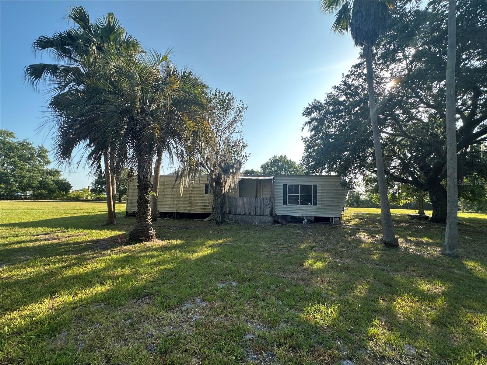 Opportunity Awaits in Desirable Manor Area! This 2.63-acre property offers endless potential with a mobile home that is ready for a complete remodel-or the ideal location to build your dream home and take advantage of the impact fee credit. Enjoy privacy and space with mature landscaping, partial fencing, and in-ground pool already in place. Whether you're looking to renovate or start fresh, this expansive lot provides a rare chance to own acreage in a sought-after area. Don't miss out on this unique investment or new home opportunity!