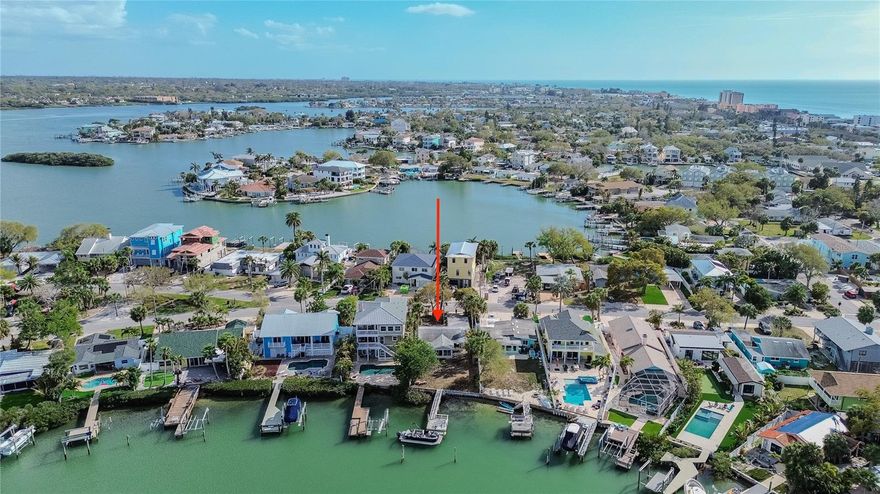 Waterfront retreat! Nestled at the southern apex of coveted Dolphin Bay and just three blocks from the Gulf with one of 27 beach access points in Indian Rocks Beach, this property offers an exceptional opportunity to enjoy waterfront living in one of the area’s most beloved coastal communities. The updated home features two bedrooms, one full bathroom, 1,092 square feet of heated living space, and 1,618 square feet under roof. Thoughtfully maintained and recently refreshed with approximately $80,000 in improvements, the home blends comfortable living with the charm of classic Florida waterfront properties. Inside, the updated kitchen offers stainless steel appliances, subway tile backsplash, modern cabinetry, and a breakfast bar that opens to the living spaces, creating an easy flow for everyday living. The bathroom has been tastefully renovated with coastal-inspired finishes, while large windows throughout the home bring in natural light and highlight the beautiful water views beyond. A spacious waterfront sunroom quickly becomes the heart of the home, framed by expansive windows that showcase the Intracoastal and create a relaxing place to unwind while watching boats pass by and marine life surface. Outside, the property continues to shine with nearly 50 linear feet of seawall and a 47 foot dock extending out to approximately 7 feet of draft at median high tide. Moorings are already in place to accommodate sailboats and cruisers, making it easy to bring your deep water vessel and explore the waterways right from your backyard. Natural mangroves along the shoreline create a protected habitat that attracts abundant sea life including dolphin, manatee, sea birds, and world class inshore sport fish. Spend your days water skiing, tubing, paddle boarding, or simply enjoying peaceful sunrise views over the bay. From here, sunset cruises, waterfront dining, relaxing spoil islands, and the open Gulf are all just a short boat ride away. Indian Rocks Beach remains one of the Gulf Coast’s most cherished small beach towns, known for its welcoming atmosphere and community spirit. Local seafood restaurants, surf shops, parks, art center, community garden, baseball field, and shopping are all nearby, with golf cart friendly streets making it easy to get around. Festivals and events are held throughout the year, creating a vibrant coastal lifestyle. Convenient access to two international airports and professional sports venues for the Rays, Buccaneers, Rowdies, and Lightning adds to the appeal. Whether you choose to enjoy the existing home, renovate further, or design a future waterfront retreat, opportunities like this rarely come along. Welcome to Indian Rocks Beach.