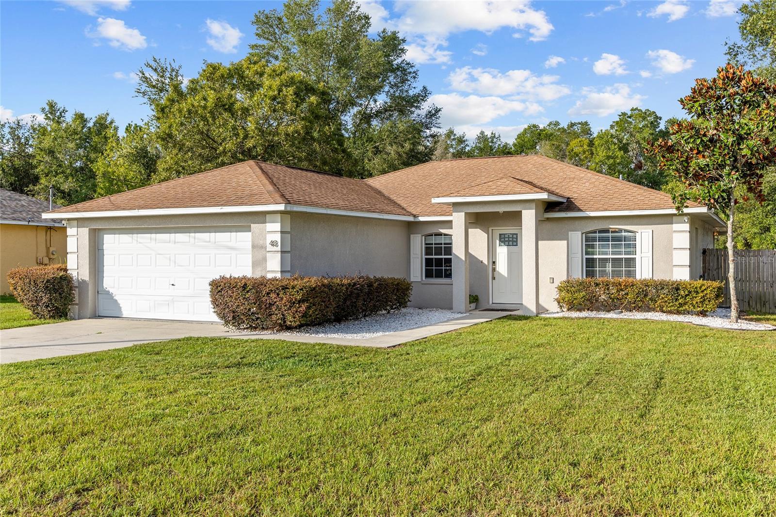 SELLERS ARE OFFERING A ROOF WITH FULL PRICE OFFER! Welcome to this beautifully maintained 3-bedroom, 2-bathroom home built in 2006, offering the perfect blend of comfort, modern upgrades, and Florida living at its best. Situated in a desirable Ocala location with no HOA, this property is ideal for those seeking both freedom and convenience. Step inside to find an inviting open layout featuring cathedral ceilings and tile flooring throughout for easy care and timeless appeal. The heart of the home is the brand-new modern kitchen, complete with quartz countertops, sleek cabinetry, and recently upgraded stainless steel appliances—a dream space for both everyday cooking and entertaining with an eat-in breakfast nook. The spacious living area flows seamlessly to the outdoors where you’ll enjoy an oversized screened lanai under a durable metal roof, overlooking the fully fenced backyard—perfect for family gatherings, pets, or weekend relaxation. The private primary suite offers dual closets and an en-suite bath, while two additional bedrooms provide plenty of flexibility for guests, a home office, or hobbies. The laundry room is conveniently located in the garage, keeping the main living areas tidy and functional. For peace of mind, the home will come with a brand-new roof installed prior to closing—a major upgrade for the next owner.This move-in ready home is the perfect combination of modern updates and practical features—ready for its new owners to enjoy!