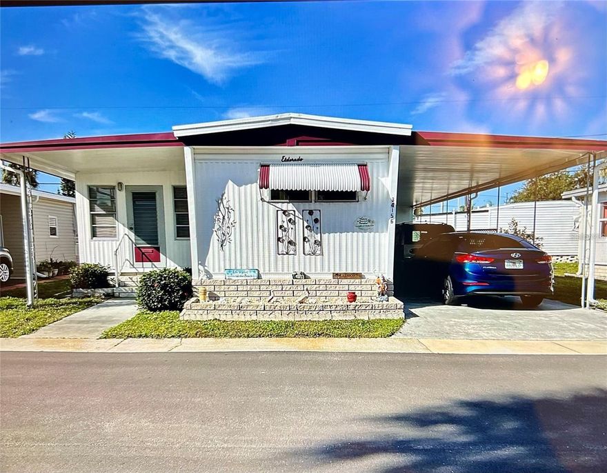 Come check out this 2 bedroom, 1.5 bath home with a New carport (2025)… This home is move in ready, fully furnished, very nice home with a SPLIT FLOOR PLAN . The spacious Family room is also air conditioned and has a front and back entry that leads to the partially covered back lanai. HVAC new in 12/2024. Roof  2012, is a lifetime warranty Alum roof-over, and does include the SHARE (valued at $55,000)… This park is 1 of Pinellas County‘s best kept secret in my opinion, very inexpensive living at only $210 per month which includes all the amenities one could want; water/sewer/trash, owned clubhouse, escrows are fully funded, beautiful heated pool and spa, fitness center, library, shuffleboard, billiard table, and a small lake at the back of the park, laundry room, and your very own private entrance to the super Walmart… On foot, bicycle or golf cart… Etc., etc. This location is close to churches, shopping, restaurants, approx 20-30 minutes to the beach or Tampa Int’l Airport. Jump on I-275 to Tampa, Sarasota, etc.