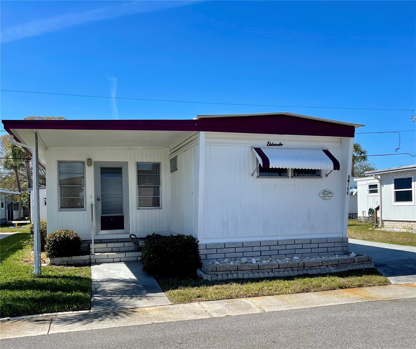 Come check out this 2 bedroom, 1.5 bath home with a New carport (2025)… This home is move in ready, fully furnished, very nice home. The spacious Family room is also air conditioned and has a front and back entry, It has a front door and a back door to the the partially covered back lanai. HVAC new in 12/2024. Roof 2012, is a lifetime warranty Alum roof-over, this home is priced to sell… and does include the SHARE (valued at $55,000)… This park is 1 of Pinellas County‘s best kept secret in my opinion, very inexpensive living at only $183.05 per month which includes all the amenities one could want; water/sewer/trash, owned clubhouse, escrows are fully funded, beautiful heated pool and spa, fitness center, library, shuffleboard, billiard table, and a small lake at the back of the park, laundry room, and your very own private entrance to the super Walmart… On foot, bicycle or golf cart… Etc., etc. This location is close to churches, shopping, restaurants, approx 20-30 minutes to the beach or Tampa Int’l Airport. Jump on I-275 to Tampa, Sarasota, etc.