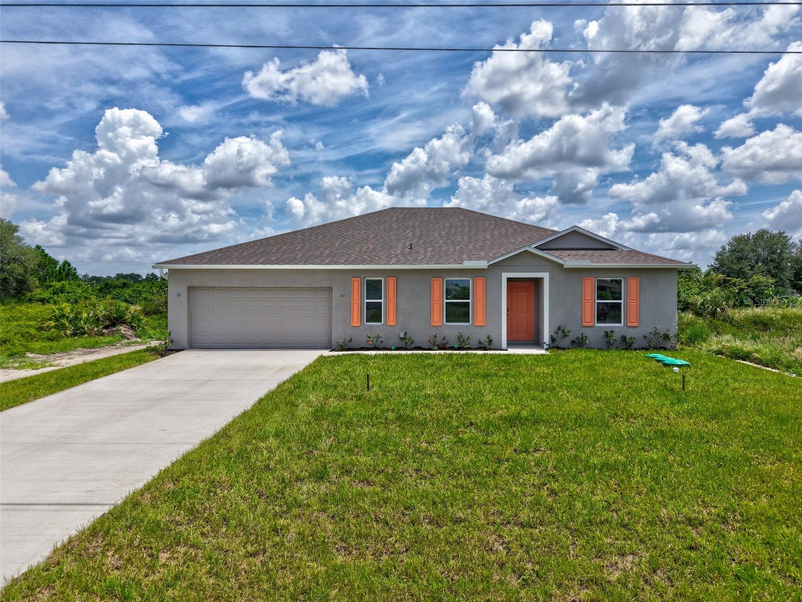 Step into this stunning, brand new home in a highly sought-after Lehigh Acres location, just moments from SR82 and Alabama Road. This prime location offers the best of suburban living with exciting growth on the horizon. This spacious single-floor residence offers ample living space with 4 bedrooms, a versatile den, and 2 full bathrooms. Enjoy the peace of mind that comes with a newly constructed home, complete with a 2-car garage and a relaxing concrete slab patio, perfect for outdoor entertaining. Throughout the main living areas, you'll appreciate the sleek and easy-to-maintain tile flooring, offering a touch of elegance and durability (excluding the bedrooms).Relax and entertain outdoors on the private concrete slab patio, ideal for enjoying the beautiful Florida weather. This home is ideally located near major roadways like SR82 and Alabama Road, ensuring easy access to shopping, dining, and other amenities. A well-known grocery store and a home improvement store are coming soon nearby, making errands and weekend projects effortless. Additionally, new schools are slated for development in the area, offering excellent educational opportunities for families. Don't miss this chance to be part of a rapidly developing area with increasing amenities and a welcoming atmosphere. Schedule your showing today!