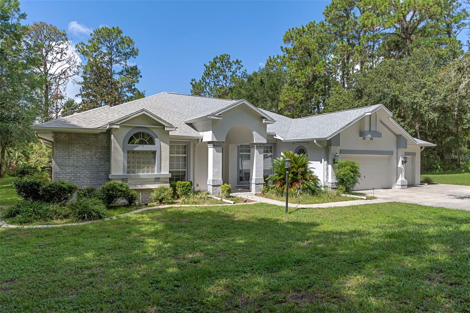 Spacious 3BR, 3BA, Office, 3-car garage Home with Heated Saltwater Pool on 1 Acre
Welcome to this beautifully maintained 3-bedroom, 3-bathroom home with a 3-car garage, perfectly situated on a serene 1-acre lot. Offering 2,775 sq. ft. of comfortable living space, this home blends style, function, and outdoor enjoyment.
The heart of the home is the large kitchen, featuring a center island, rich wood cabinetry, Corian countertops, stainless steel Maytag appliances including a double oven, and plenty of storage. The open layout flows into the main living area, enhanced by gleaming hardwood floors and plantation shutters.
Step outside to your private backyard oasis — a heated saltwater pool with a tranquil waterfall, an open deck with an electric awning for shade, and lush landscaping irrigated by a PRIVATE WELL. Enjoy peaceful mornings and relaxing evenings surrounded by nature.
Recent upgrades include a BRAND NEW ROOF. 3-zone A/C system, water softener, central vacuum, security system, and hurricane shutters for peace of mind. A 12x24 shed with electric and a 26x14 carport offer extra storage and workspace.
This property combines comfort, convenience, and quiet country charm — ready for you to move in and start living your dream. Some photos have been virtually staged.