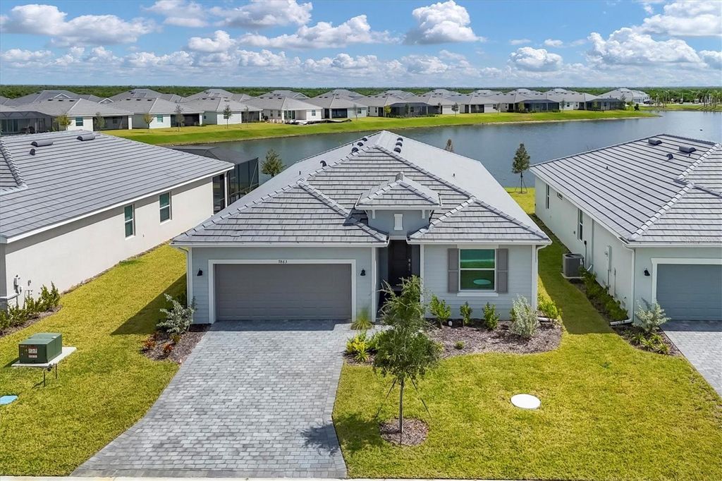 Photo of 7863 Lakes Edge Lane, Port Charlotte, FL 33981 (MLS # D6144052)
