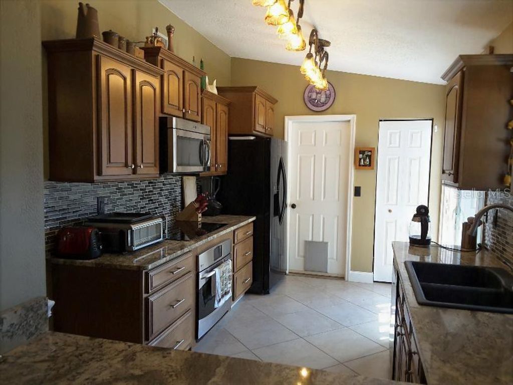 Photo of 74 Berkshire Lane, Palm Coast, FL 32137 (MLS # O6356902)