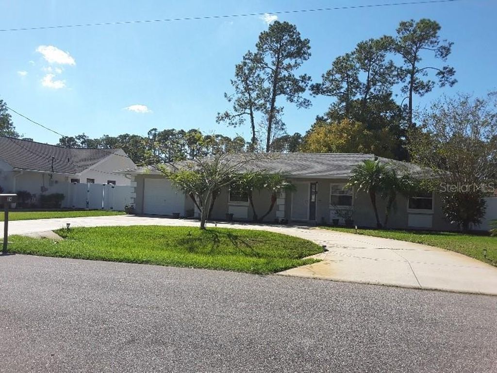 Photo of 74 Berkshire Lane, Palm Coast, FL 32137 (MLS # O6356902)