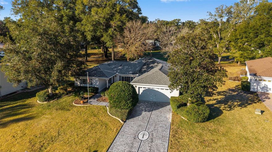 GREAT BONES on this OPEN CONCEPT 3 bedroom STUCCO GOLF COURSE HOME on over a quarter acre in a CUL-DE-SAC ! ROOF 2018, HVAC 2021, WATER HEATER 2024, WATER SOFTENER, REVERSE OSMOSIS at kitchen sink. ALL ONE LEVEL LIVING... no steps anywhere!! Not at front door,  garage entry,  lanai or anywhere thru the house! Doors have hinges for maximum width openings. Inside laundry room with wash tub sink. Lanai with GLASS WINDOWS offer Panoramic views of the 16th T-Boxes. No chance of getting hit by errant golf balls in this  location. The house is a blank canvas waiting for your good taste and personal style, the peaceful and spacious setting will make this home a dream come true when refreshed ! The active fun friendly 55+ gated golf community of SPRUCE CREEK PRESERVE is nestled into 4000 acres of Nature Preserve providing a relaxed lifestyle while offering a large variety of activities and amenities like heated pool, spa, pickleball, tennis, cornhole, horseshoes, shuffleboard, bocce ball, fitness center, water aerobics, yoga, exercise classes, chair volleyball, billiards, crafts, cards, game night, bingo, bunco, potluck dinners, dances, social and travel groups. Minutes from golf, groceries, restaurants, shopping, medical, hiking and biking trails. North Central Florida location is ideal for day trips all across the state. and conveniently located near 3 major airports, cruising ports, amusement parks, and world Equestrian Center.