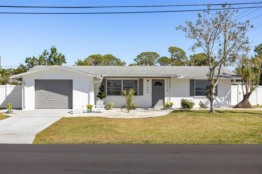 Discover this exceptional opportunity just 2 miles from the coast! This spacious 0.30-acre corner lot offers the perfect blend of coastal charm, modern updates, and room to grow—whether you envision a personal beachside escape, a forever home, or a smart investment with income potential. With plenty of space for a pool, a second home, or storage for your boat or RV, this property is designed for flexibility and endless possibilities. Located in a non-HOA community with no HOA fees and no CDD fees, you’ll enjoy the freedom to truly make this property your own. Thoughtfully updated and ready for you, the home features brand-new luxury vinyl plank flooring, a fully renovated kitchen with all-new appliances, and a fresh, inviting interior. Major electrical upgrades were completed in 2025, including a service upgrade from 100 amp to 200 amp, along with a new meter main and subpanel. New Roof installed in 2025 and fully fenced in yard. The AC was replaced in 2018. These valuable updates add peace of mind for future homeowners. The private backyard creates a quiet retreat, perfect for relaxing or entertaining. One of the biggest advantages? This home has remained high and dry with no flooding during past storms, a valuable feature in a beautiful beachside community known for its relaxed coastal lifestyle, sparkling waters, and charming local amenities. Nestled in Englewood, a hidden gem on Florida’s west coast, this home is just minutes from pristine beaches, local restaurants, boutique shopping, and endless outdoor adventures. Whether you’re looking to settle into a laid-back beach lifestyle or explore its investment potential, this home is ready for you. Opportunities like this don’t come often. Schedule your private showing today and see what makes this home so special!