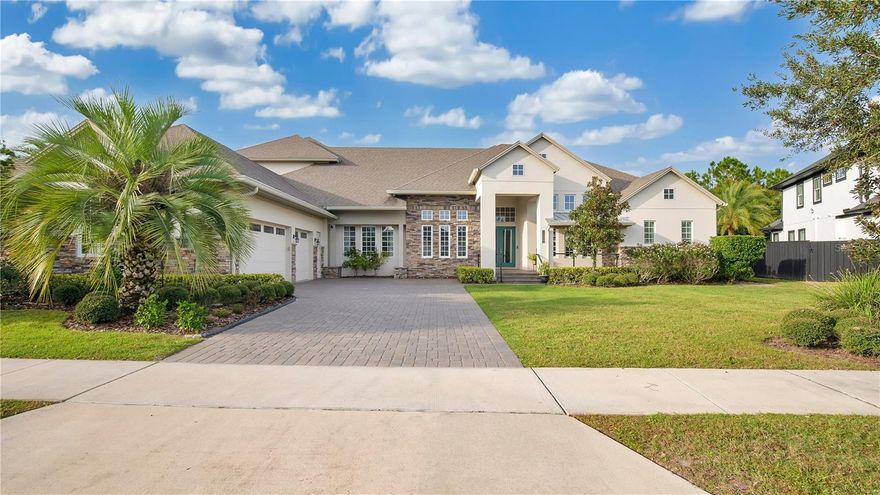This stunning 5 bedroom, 5 bathroom home boasts 5,202sqft across a half-acre lot in the well sought after neighborhood of Laurette Park, Lake Nona. Upper Harden Ave features striking luxurious upgrades and a water view.  
 
As soon as you enter the home you are welcomed by a grand foyer, soaring decorative ceilings, and oversized windows that allow natural light throughout the home. To the immediate left of the foyer you will find a front facing home office complete with glass pane French doors. At the heart of this home you will find the well appointed kitchen featuring custom crown molded cabinets, wine fridge, walk in pantry, gas stove, farmhouse sink, upgraded stainless steel appliances, oversize granite waterfall island, and gorgeous views of the backyard oasis. Additional bedrooms and bonus rooms can be found throughout the home, allowing ample space and flexibility for family and guest.
 
The Master Suite will be sure to impress with its’ own French doors and mini foyer. The Master Suite features voluminous tray ceilings, private patio access, and large reading nook. Cross over into the ensuite where you will be sure to relax in the soaking tub or oversized shower surrounded by custom tile work. If the dual vanity sinks do not impress, then the vast walk-in closet certainly will. 
 
Follow the staircase to the second floor where you will find an additional living area and large bedroom with its own ensuite bathroom.
 
The main feature of the home is the backyard oasis. When you step out onto the enclosed rear patio, you are stepping out into your own personalized sanctuary with custom pavers, an inground pool, and seating area complete with relaxing conservation and water views. The outdoor kitchen will be sure to impress with its’ built-in grill and bar top. 
 
When you are not hosting friends and family, you will be sure to venture out to experience all Laurette Park and Lake Nona have to offer. Living in Laurette Park means you have access to enjoy the fitness center, a resort-style aquatic center, tennis courts, an event venue, multiple playgrounds, miles of trails for walking, running, and biking, and more! You will have immediate access to top Lake Nona restaurants, Tavistock’s popular restaurants, Boxi Park, The Wave Hotel including Bacon, Haven, Nami, shopping amenities, and more. Once you live here, you won’t want to live anywhere else. Welcome Home!